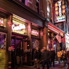 Nashville, Tennesee - January 21, 2023:  Street scene from famous lower Broadway in Nashville Tennessee viewed at night with lights, historic honky-tonks, bars and restaurants. ; Shutterstock ID 2256601017; purchase_order: 65050 - Digital Destinations and Articles; job: Lonely Planet Online Editorial; client: Best neighborhoods in Nashville; other: Brian Healy
2256601017
america, american, bars, broadway, building, business, busy, city, cityscape, clubs, country, country music, destination, district, downtown, entertainment, evening, famous, historic, honky tonk, honky-tonk, illuminated, landmark, lights, lower broadway, music, music city, nashville, neon, night, nightlife, party, place, pubs, restaurants, scene, signs, skyline, south, southern, street, street scene, tennessee, tourism, travel, urban, usa, venue, view, visitors
Nashville, Tennesee - January 21, 2023: Street scene from famous lower Broadway in Nashville Tennessee viewed at night with lights, historic honky-tonks, bars and restaurants.