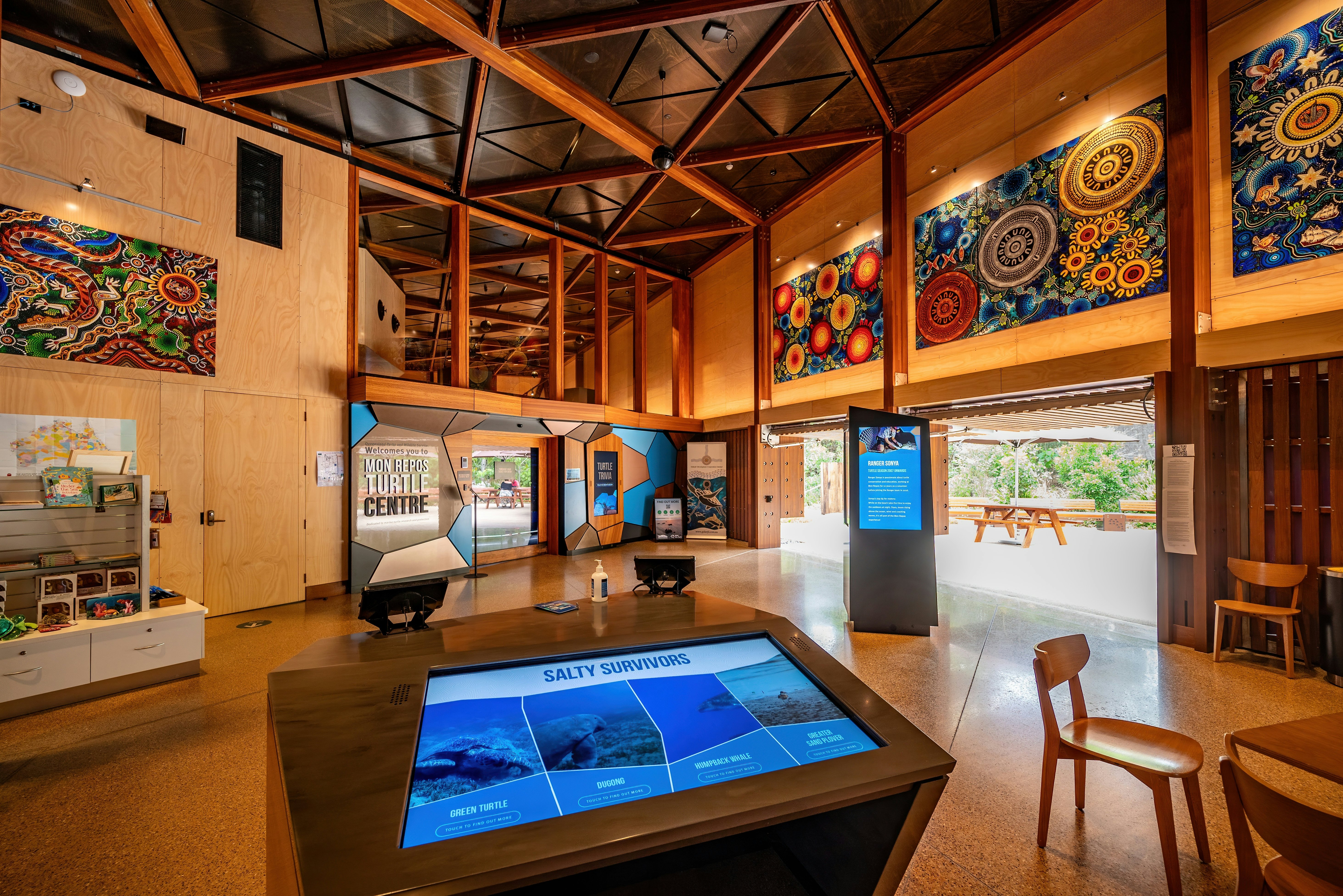 Interior of a conservation and information center dedicated to turtles with touchscreens and displays