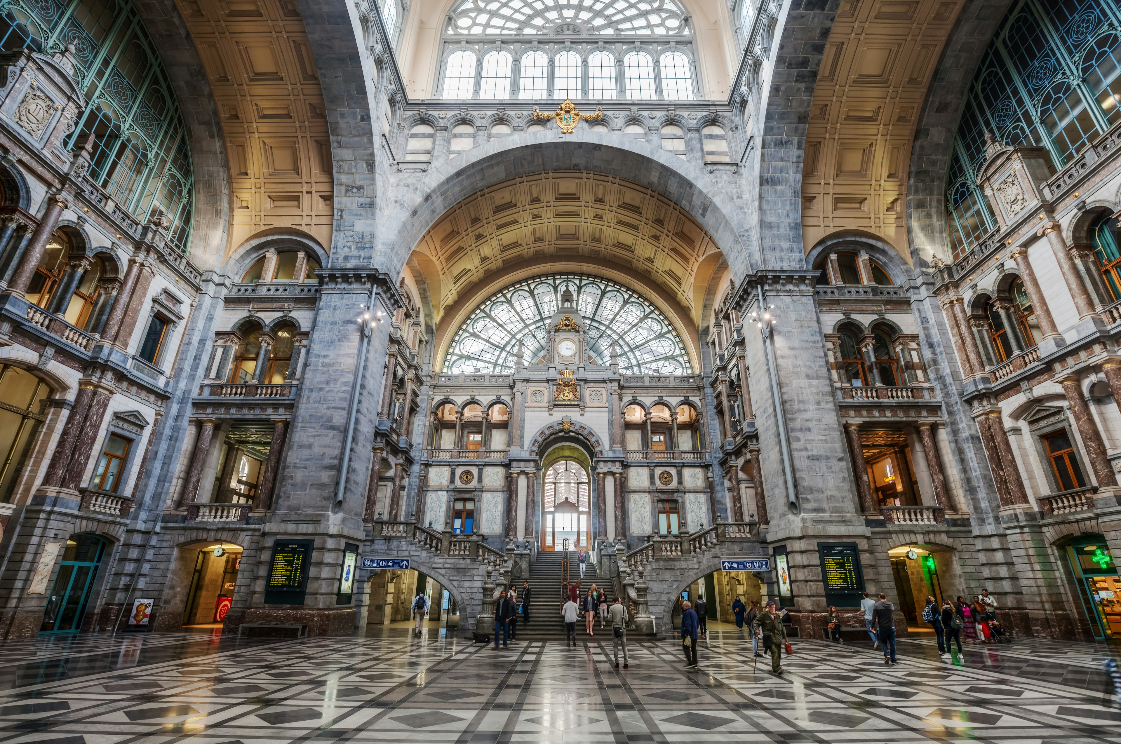 The grand central hall of a vast station with ornate ceilings and glasswork