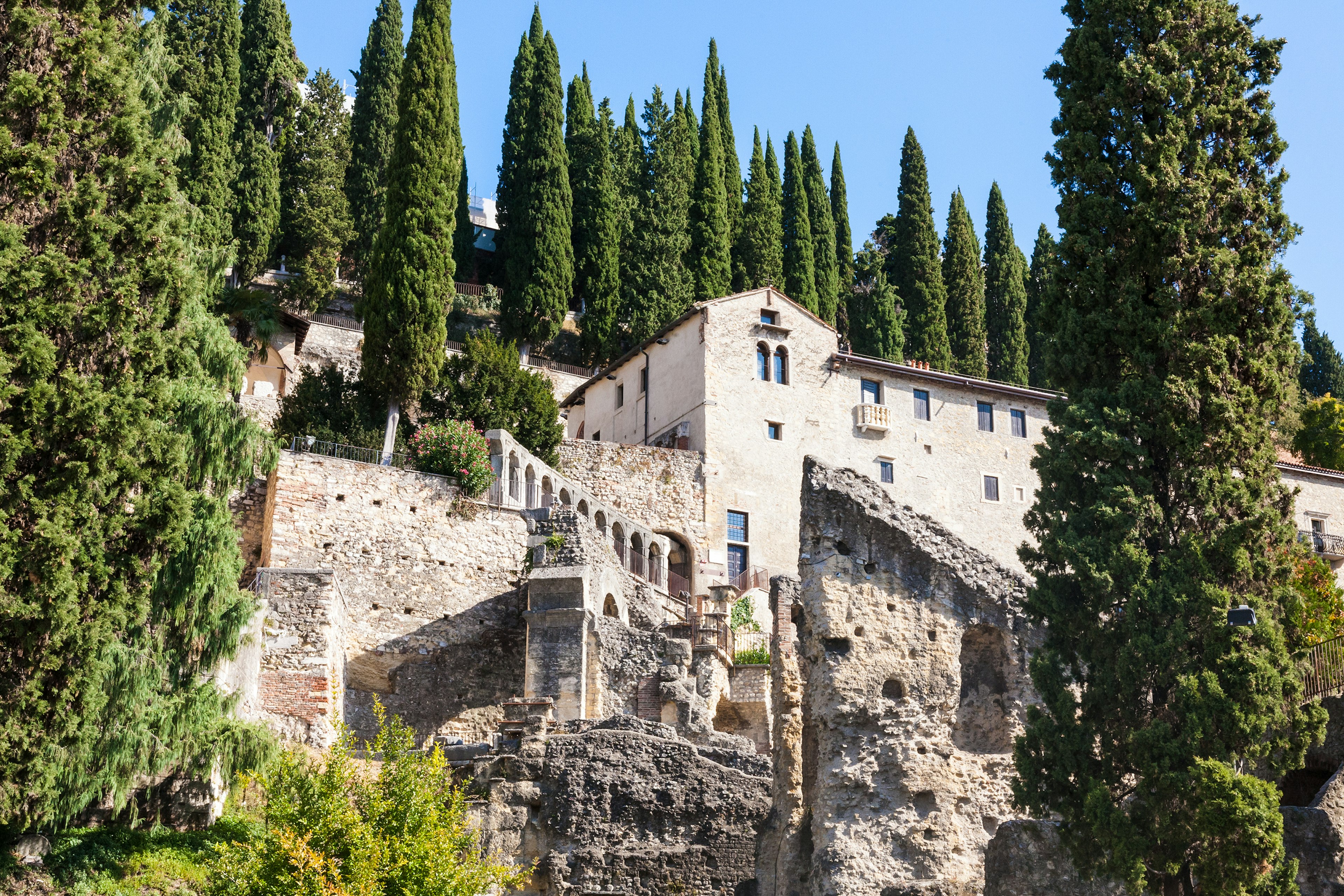 Ruins of an ancient Roman amphitheatre built into the side of a hill