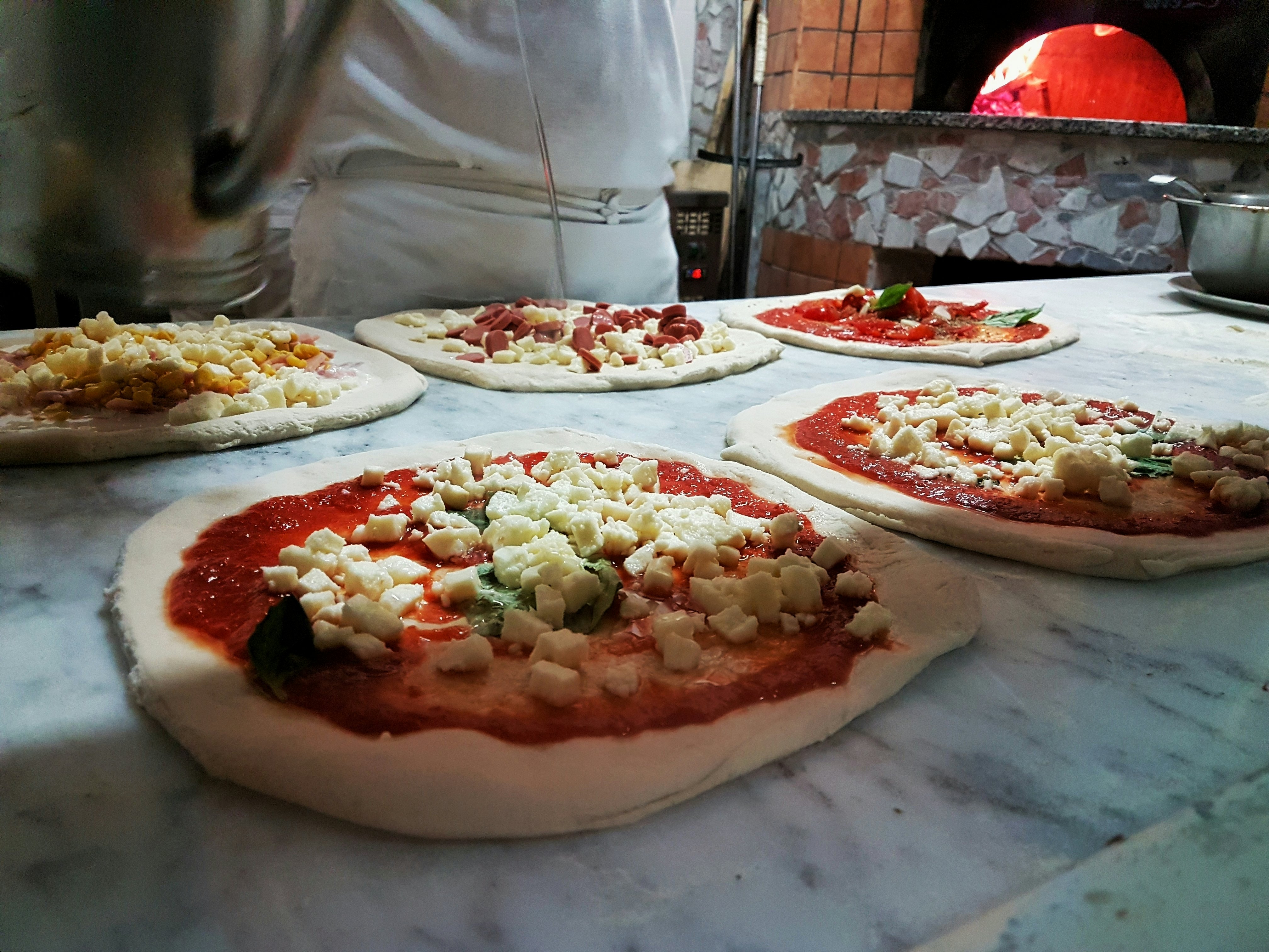 Preparing unesco real Pizza in Naples Italy.