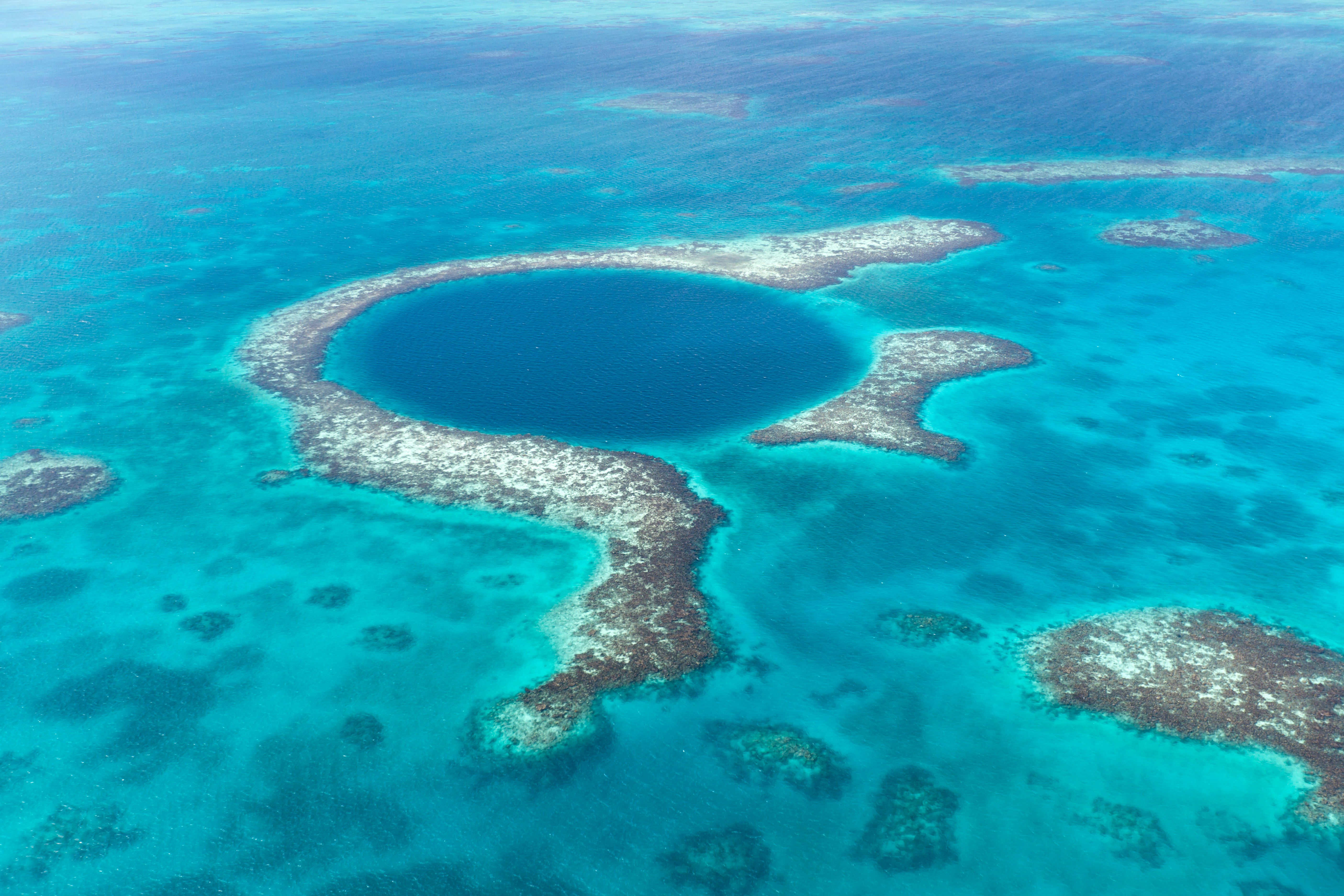 A coral reef and deep underwater cave within