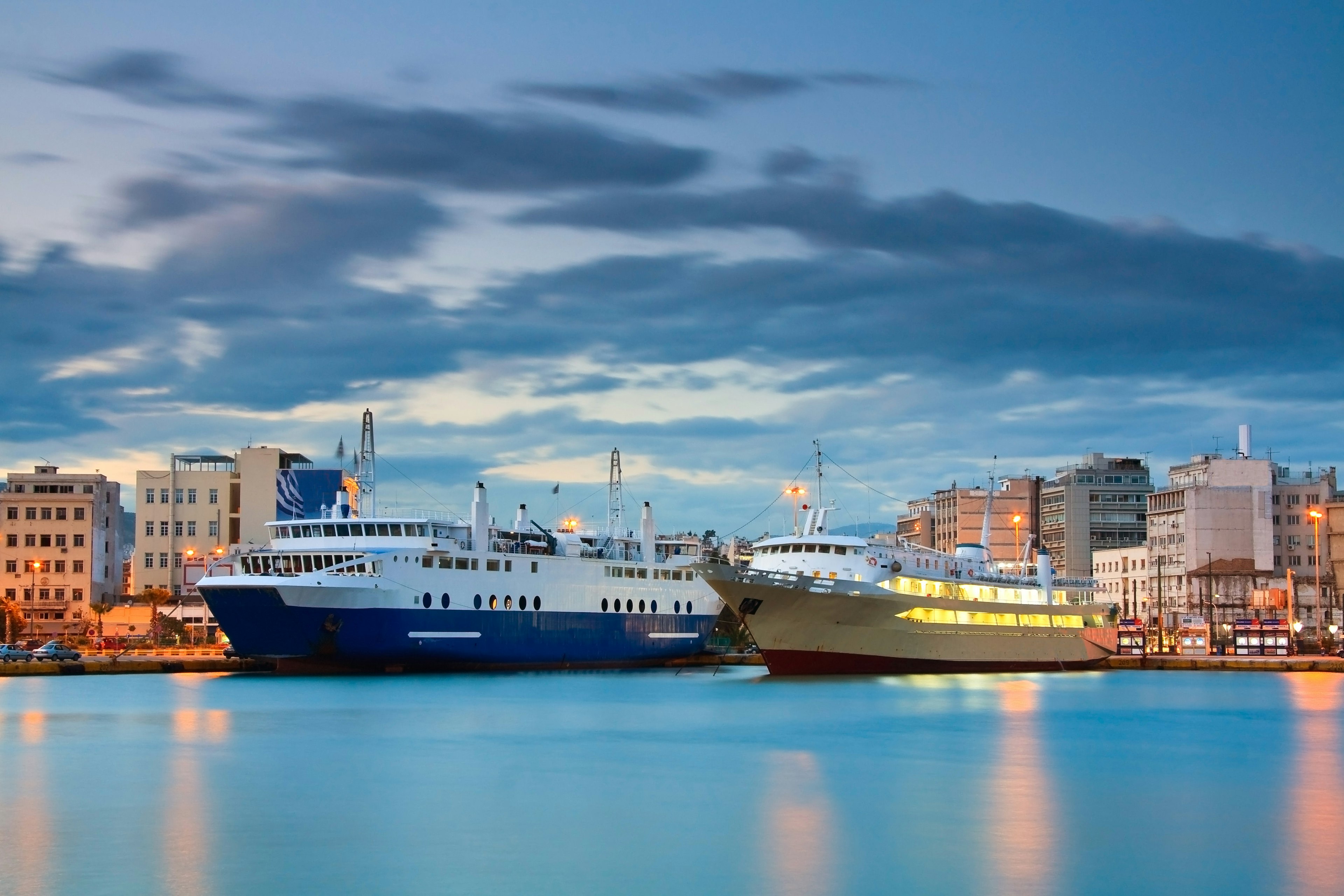 Large ferries at the port of Piraeus during the evening.