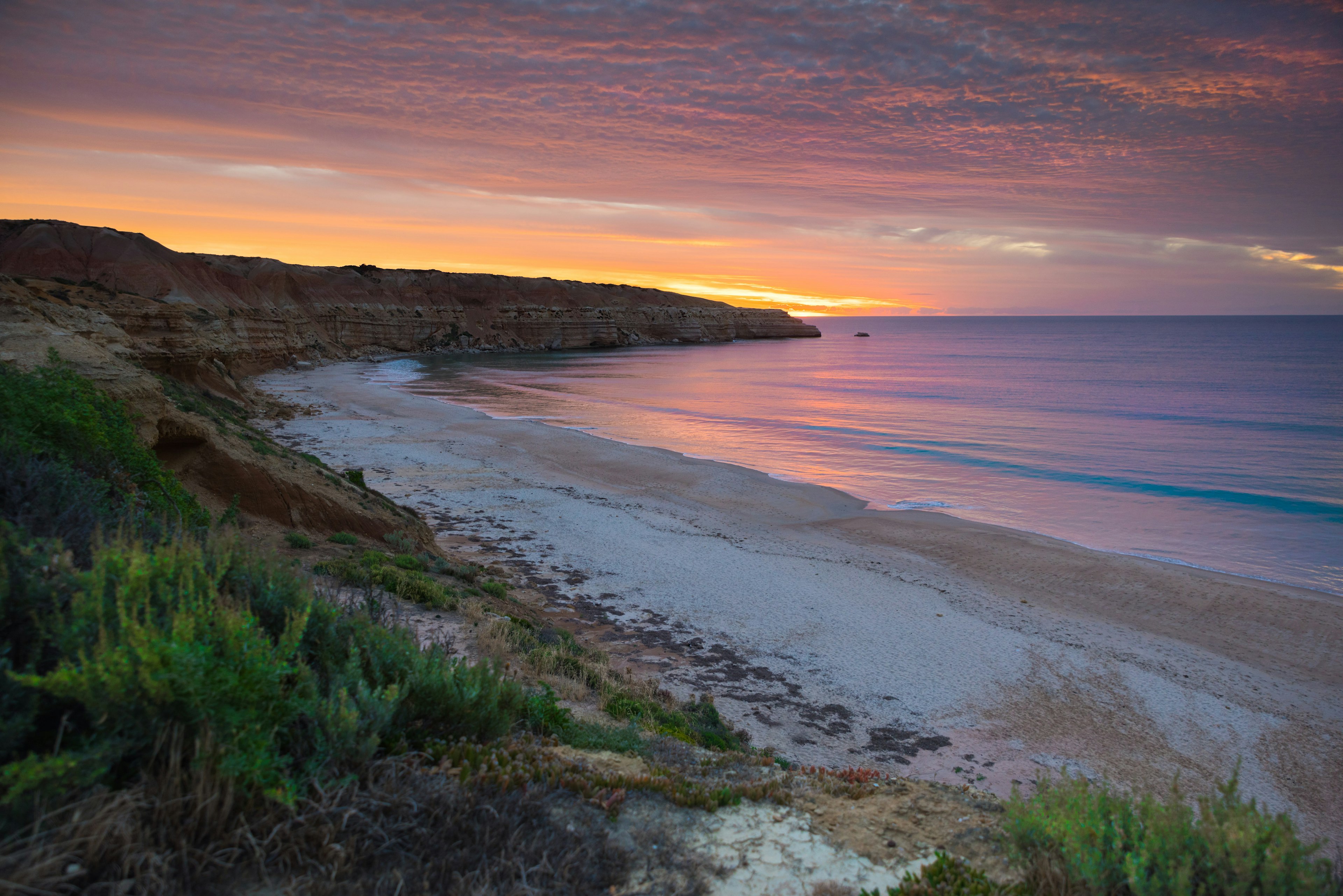 Sunset over the southern section of Maslin's Beach near Adelaide. The northern part is the regular beach, while the southern portion is Australia's first official nude beach.