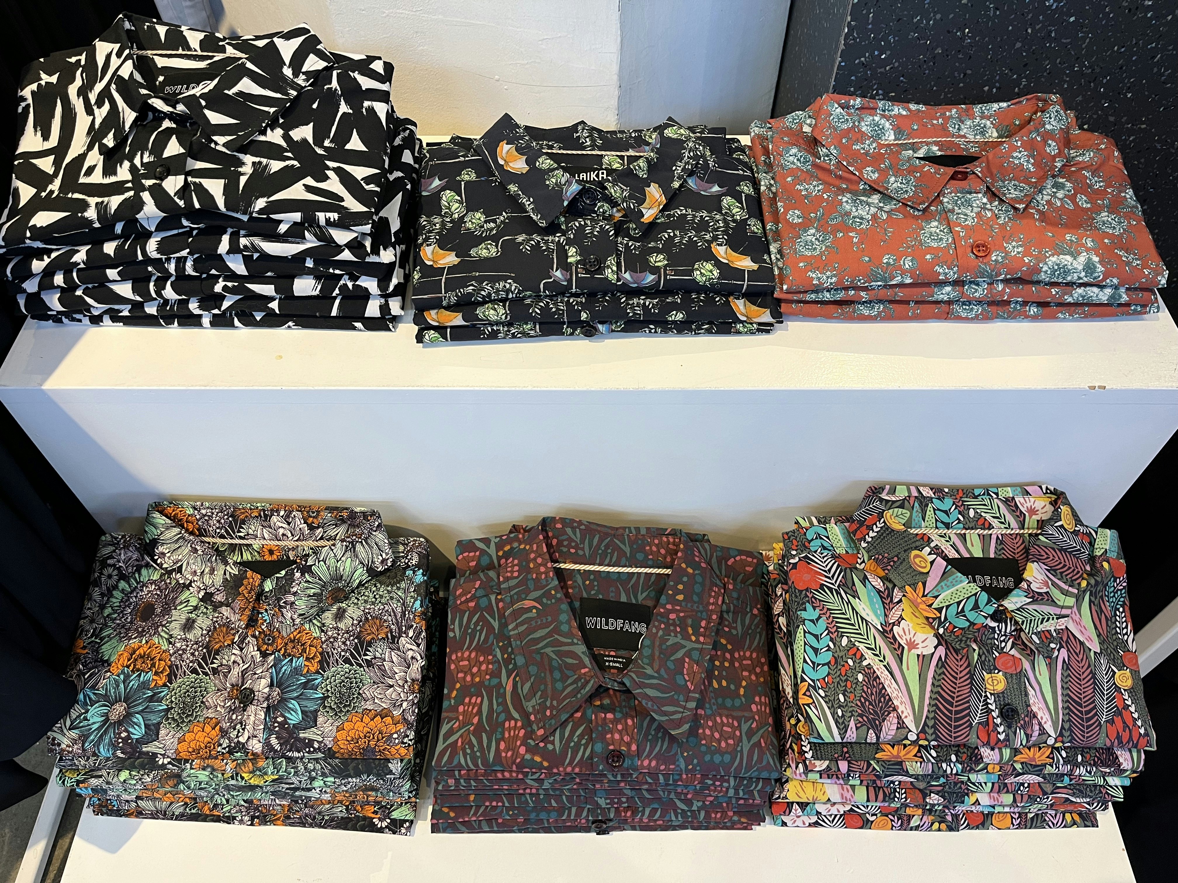 Folded patterned shirts for sale at Wildfang, an independent clothing boutique in Portland, OR