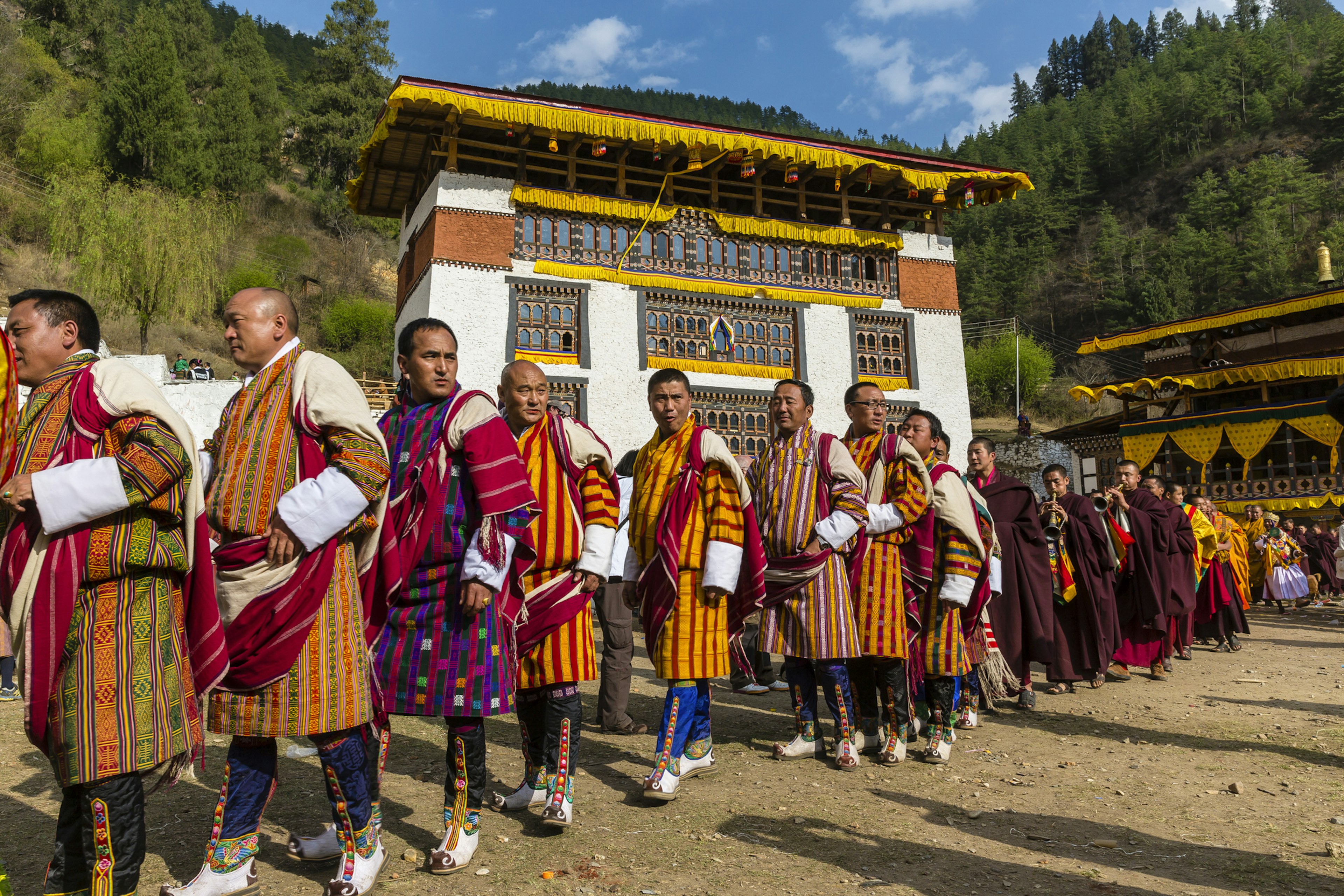 Bhutanese people in traditional gho robes, Bhutan.