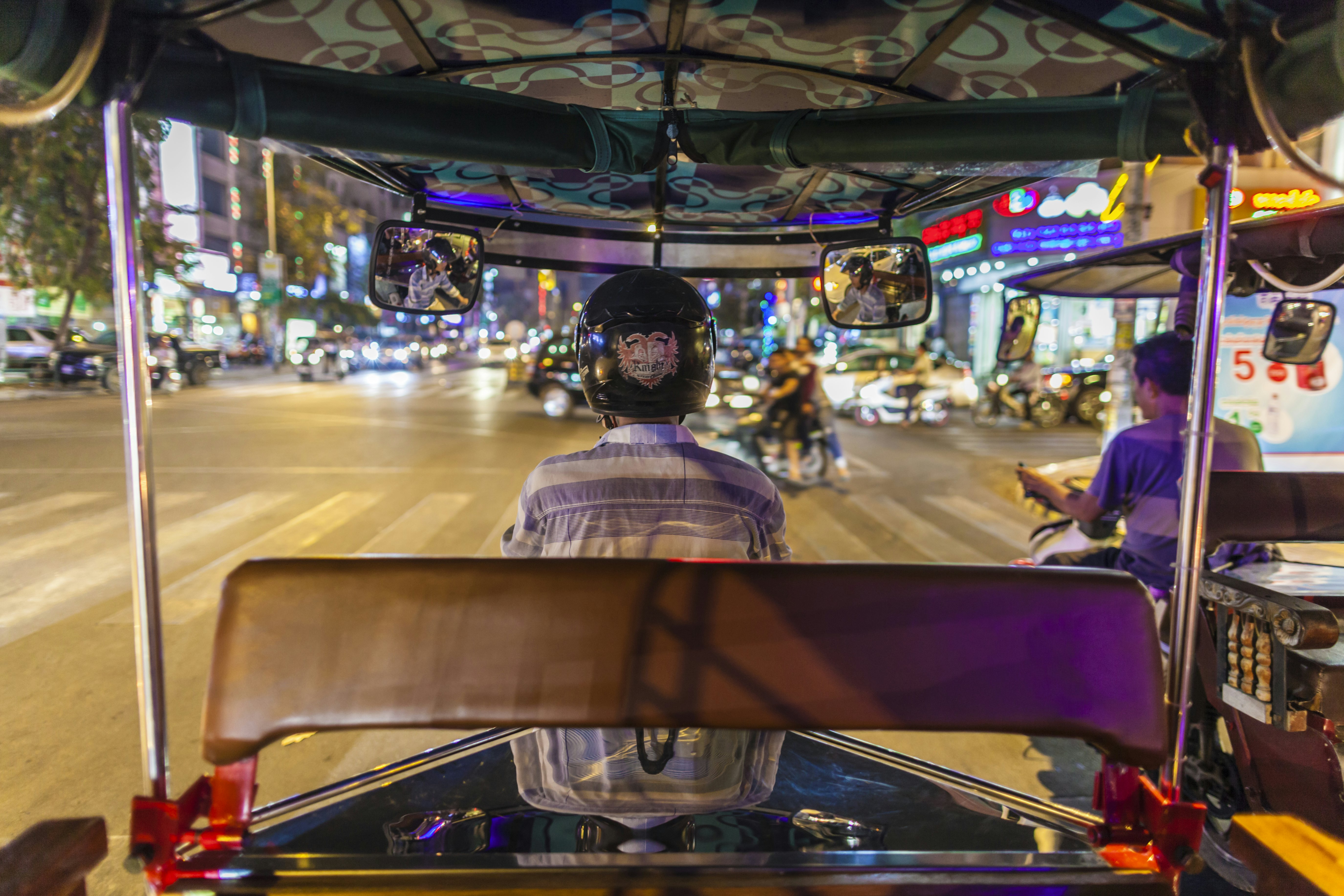 Evening street view from inside Canbodian tuk-tuk taxi