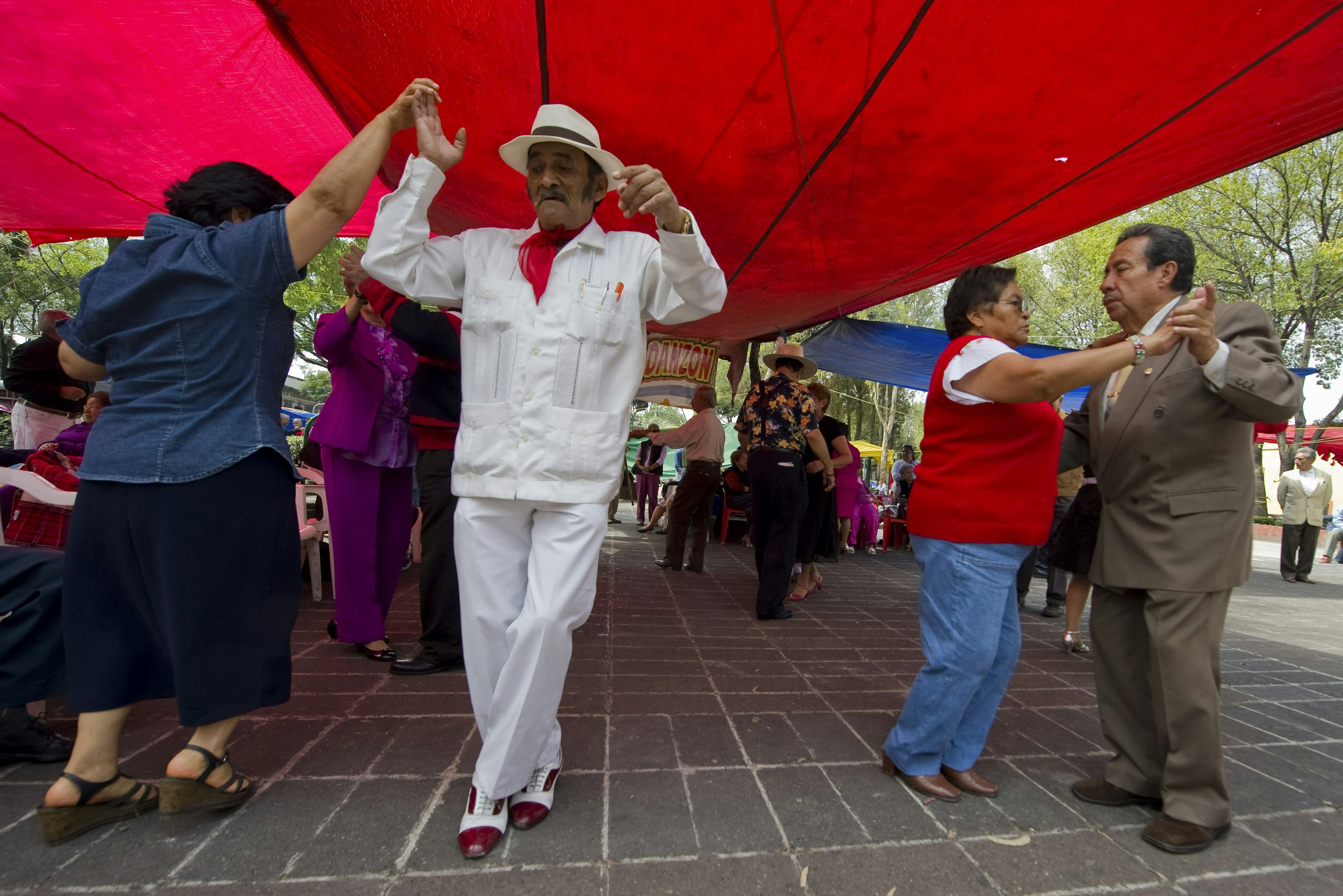 A group of the elderly people dance “danzón” at Ciudadela Square in Mexico City