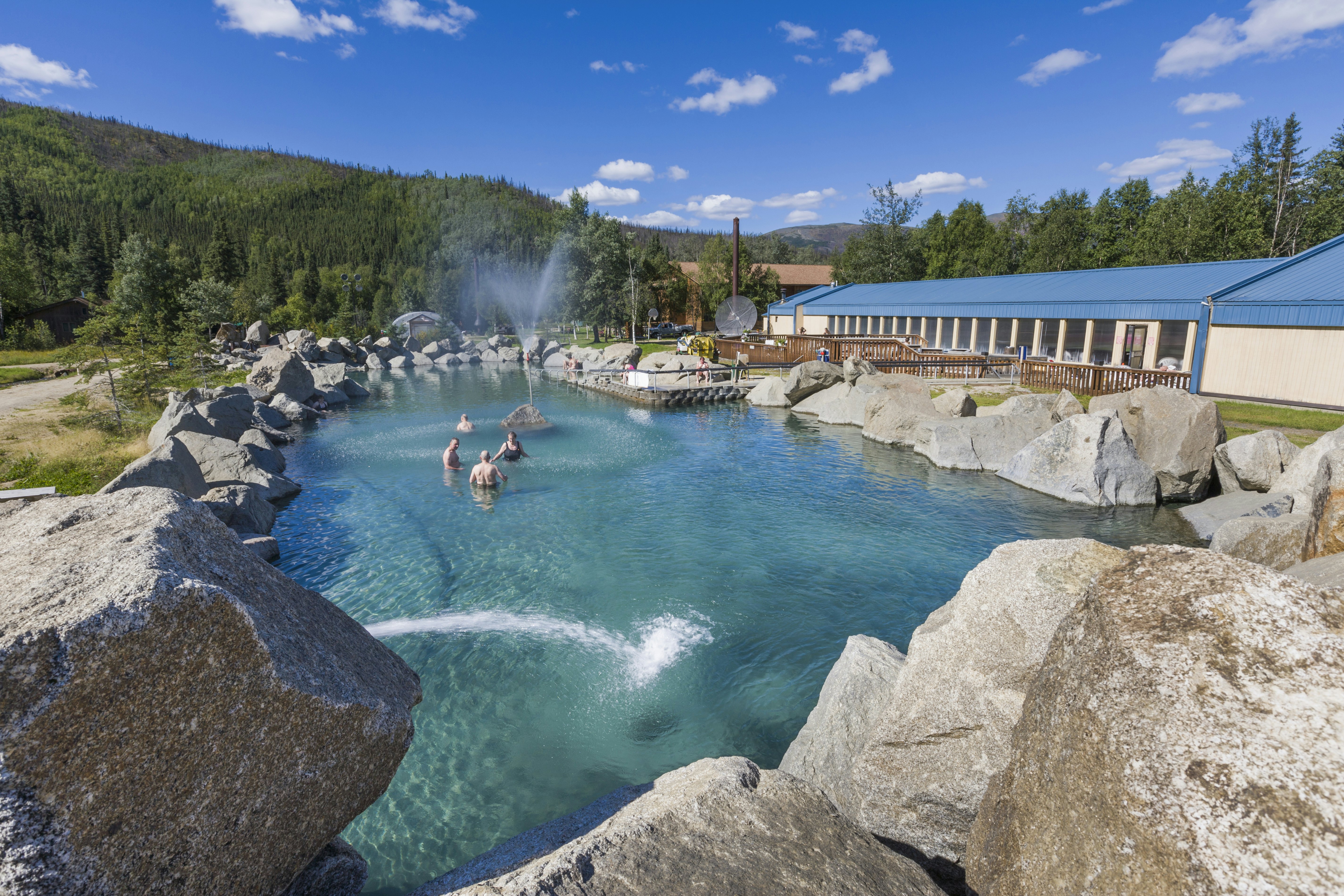 Tourists enjoy the natural hot springs pool at the Chena Hot Springs Resort, Interior Alaska