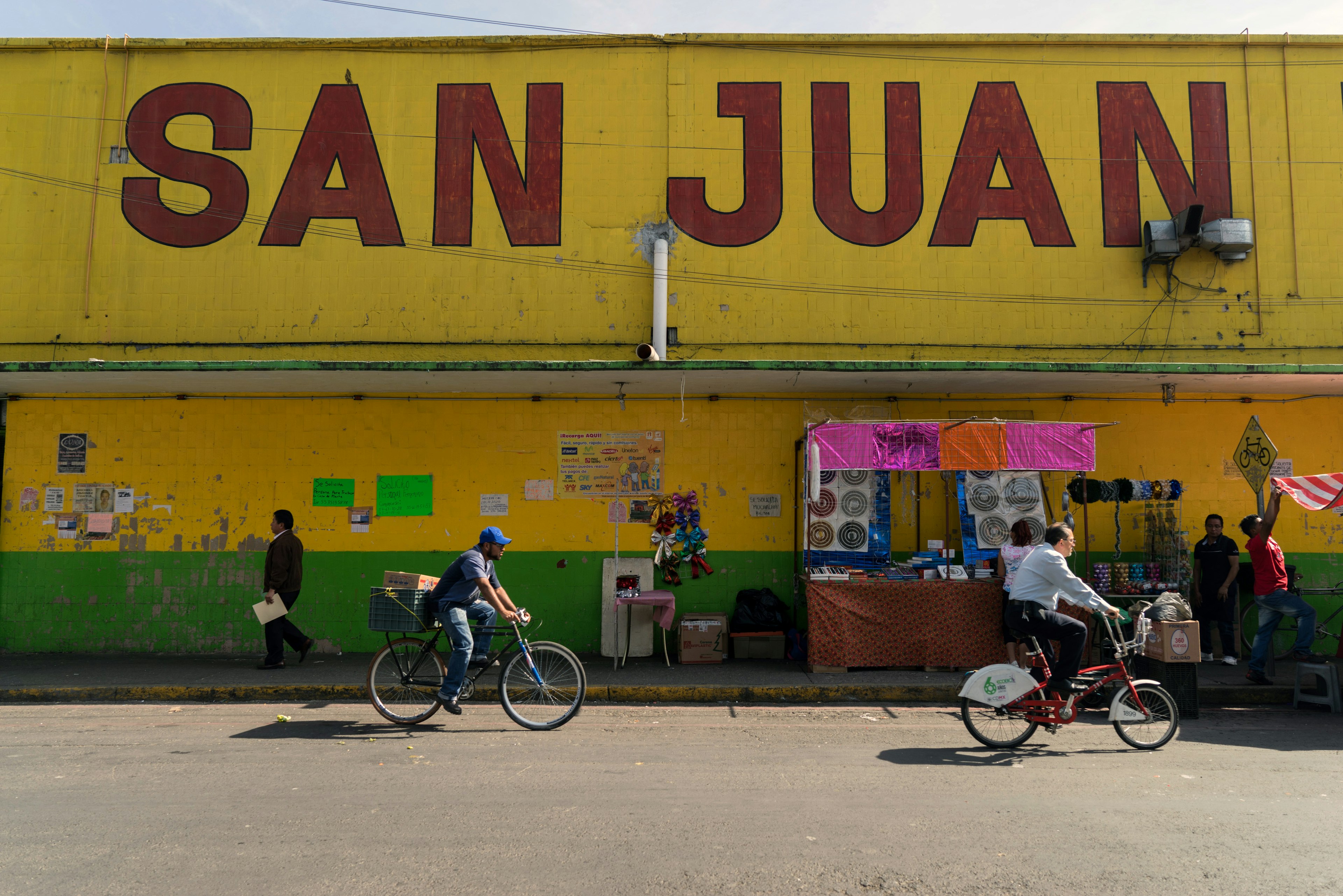 Bicyclists ride past the Mercado de San Juan in Mexico City, Mexico, on Friday, Dec. 2, 2016. The National Institute of Statistics and Geography is scheduled to release Mexico's Consumer Price Index (CPI) figures on December 8. Photographer: Cesar Rodriguez/Bloomberg via Getty Images
628284590
Americas, Food, Consumer Goods, Best Photo, South America, Groceries, Prices, Best Photos
Bicyclists ride past the Mercado de San Juan in Mexico City