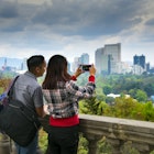 Visitors to Chapultepec Park take photographs of the views of Mexico City.  The park is on top of a rock formation called Chapultepec Hill, and is the largest city park in Latin America.