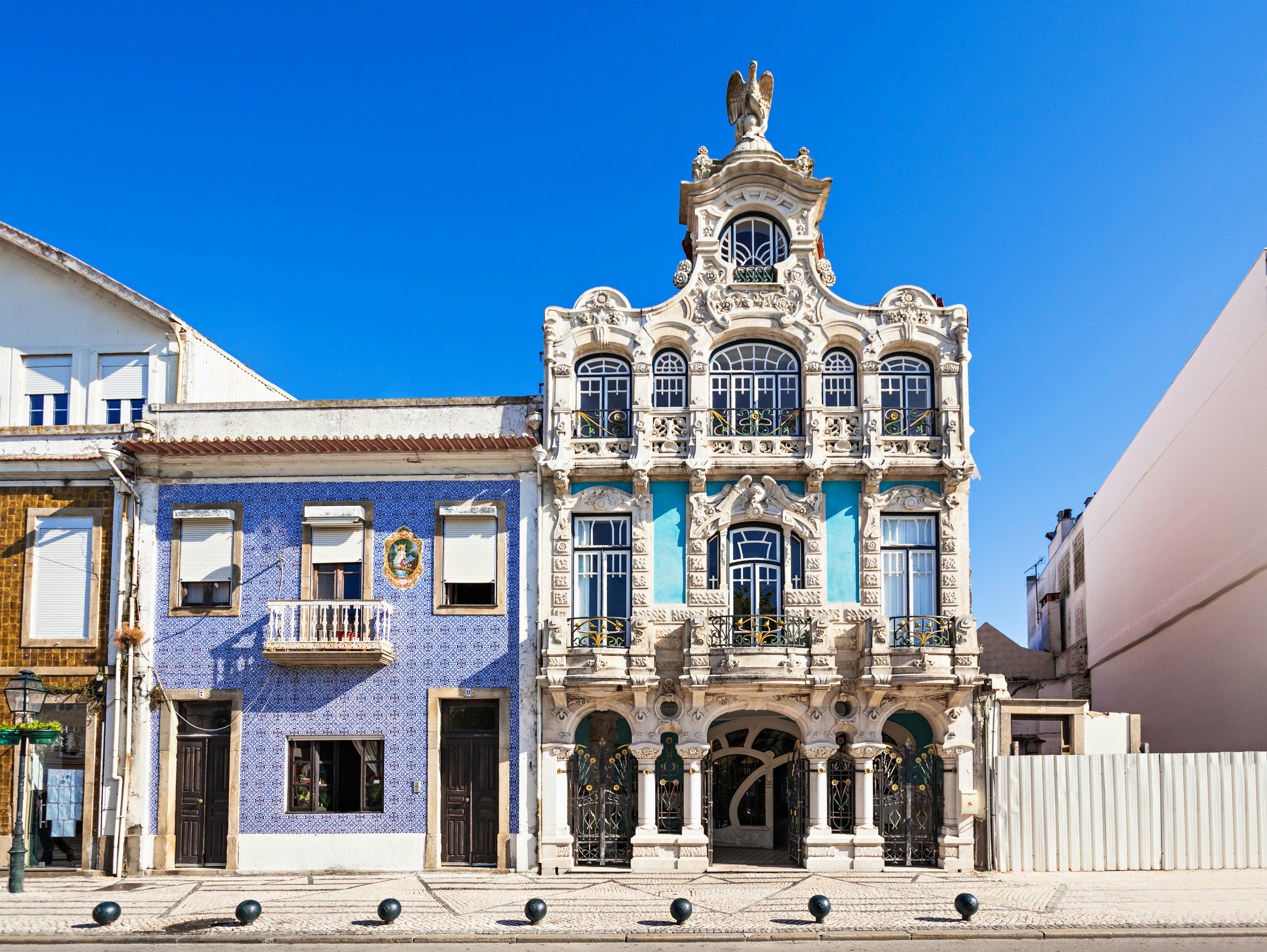 Ornate exterior of a museum building with detailed columns and wrought-iron features over balconies