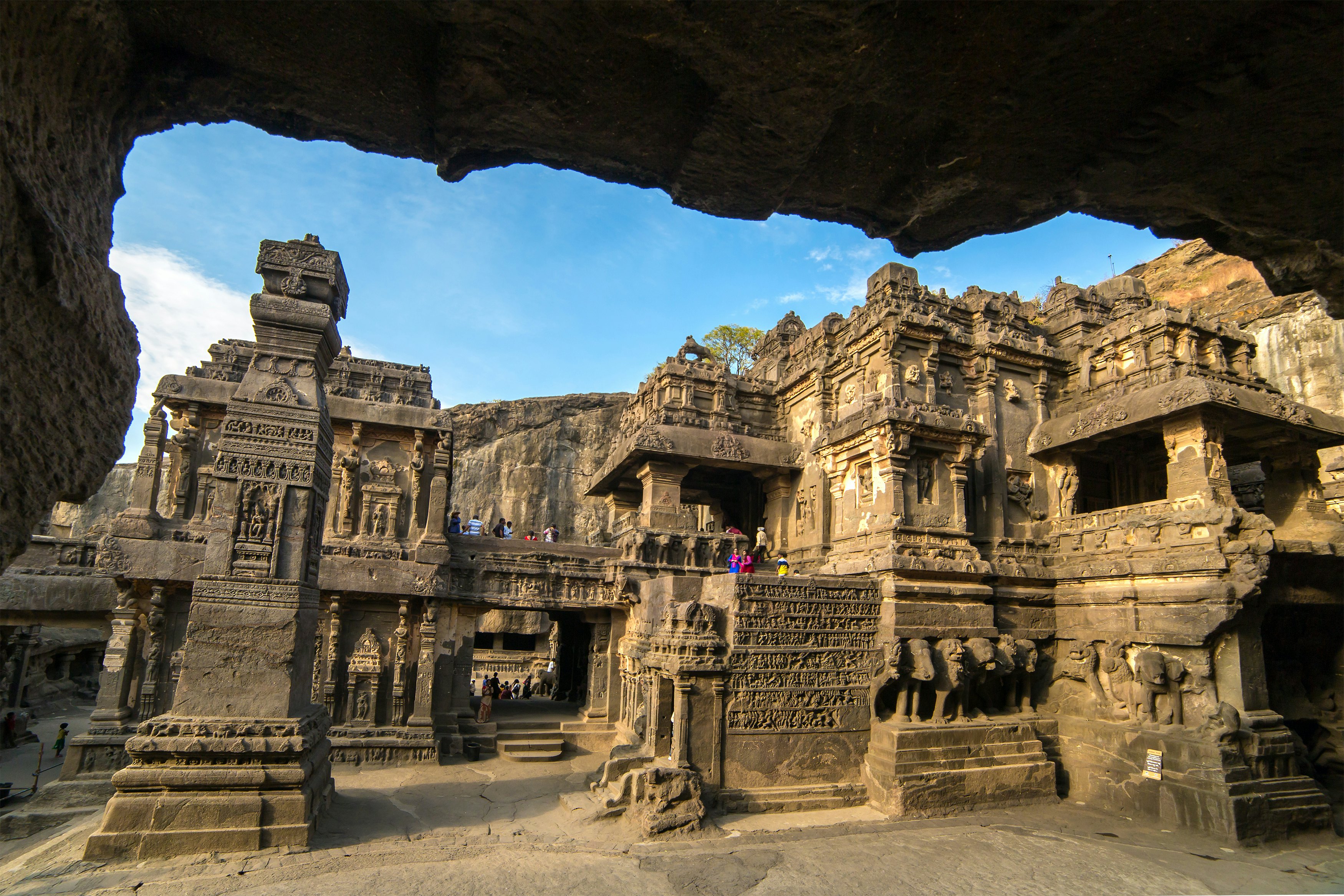 Visitors explore the rock-cut Kailash Temple at Ellora in Maharashtra, India.