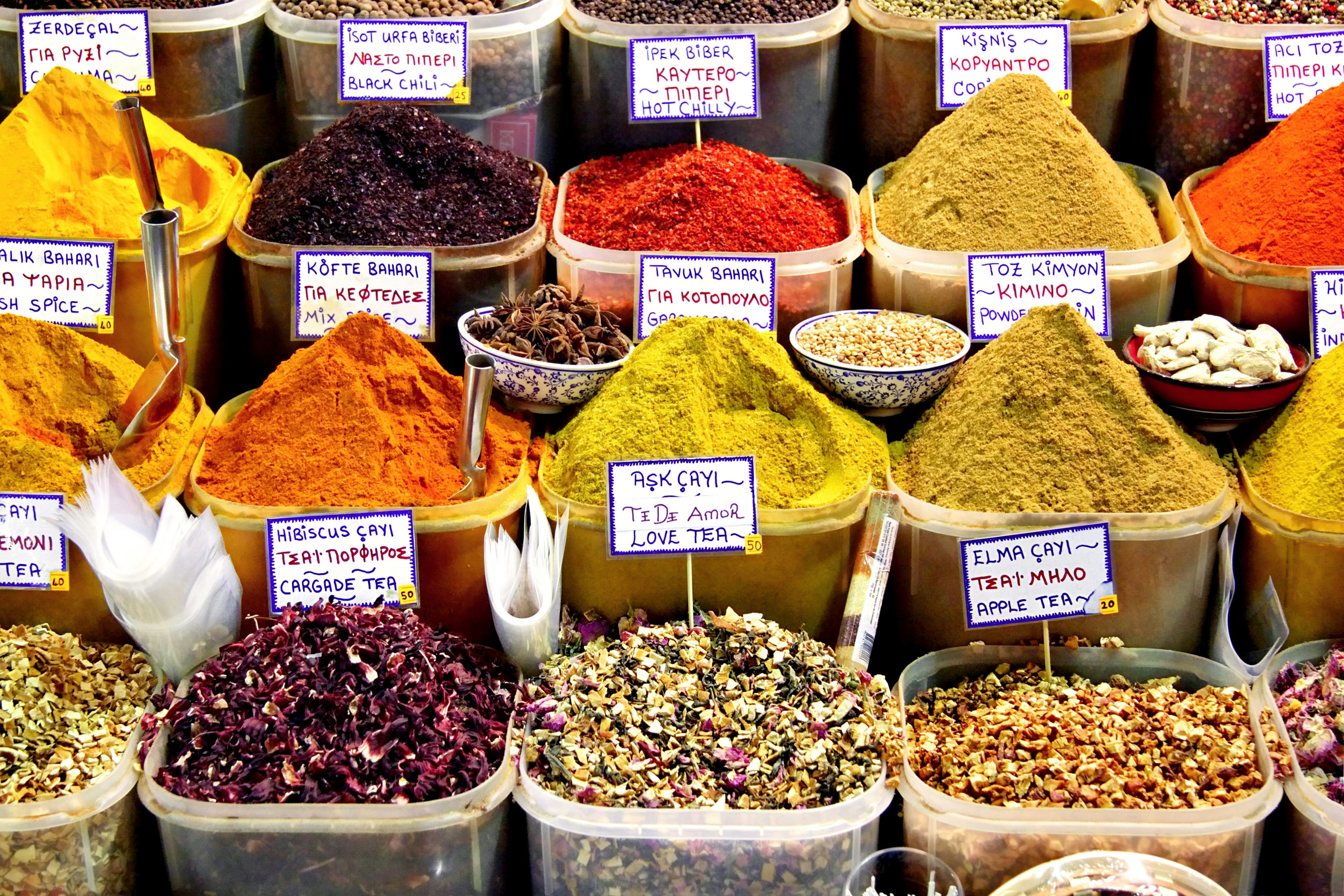 Baskets of spices on display in a market