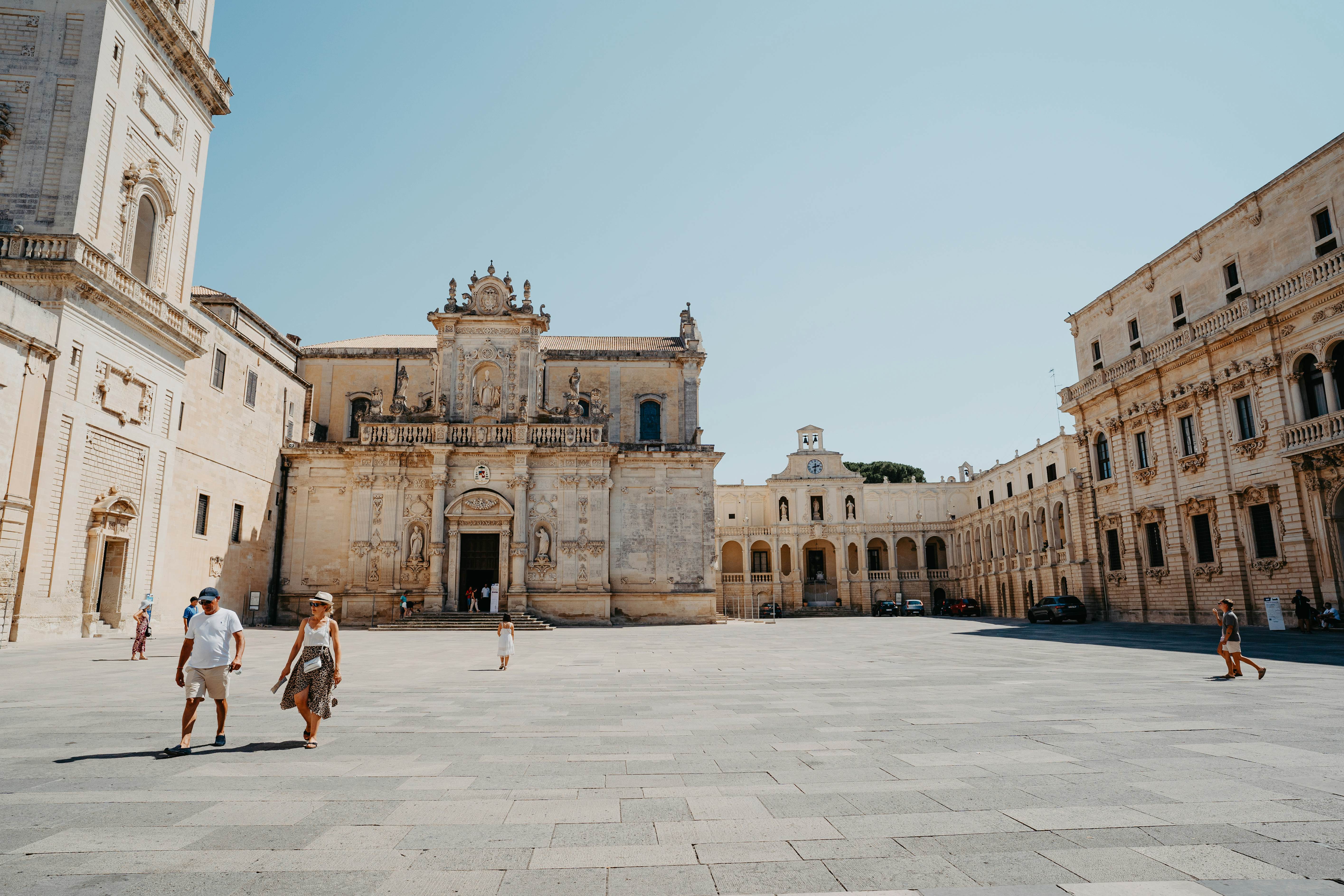 Tourists walk a near-empty square in the beautiful city of Lecce.