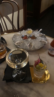 Drinks and oysters at Five's raw bar.