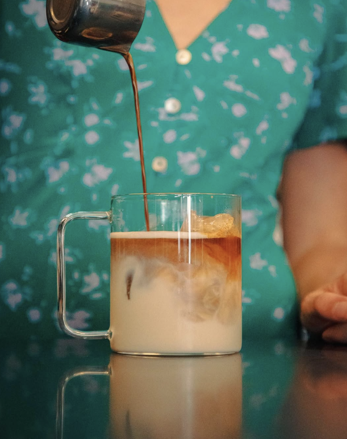 A latte in a clear mug