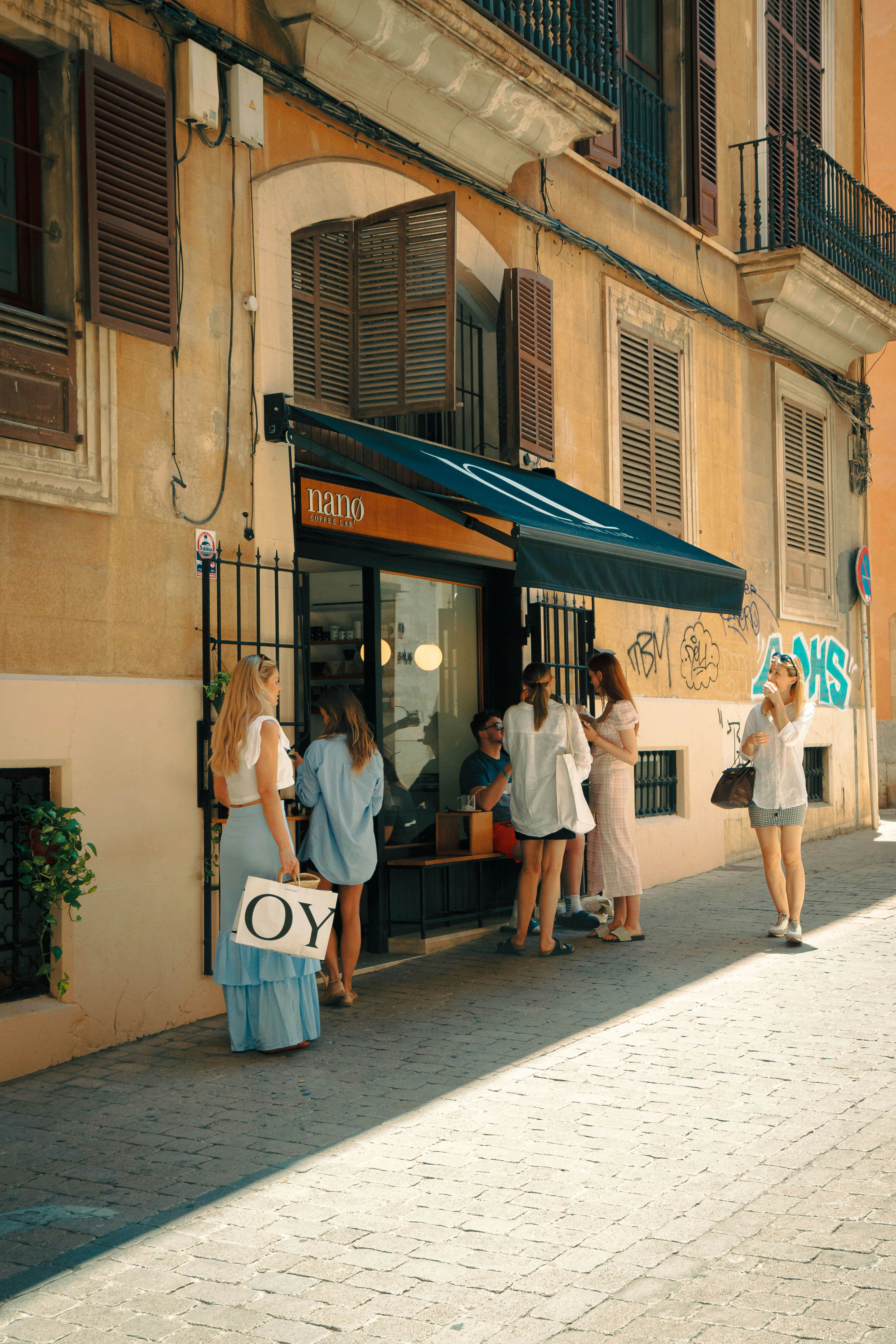 People lined up outside a coffee shop