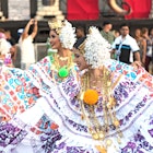 Women dancing in traditional costume at Carnaval in Panama City.