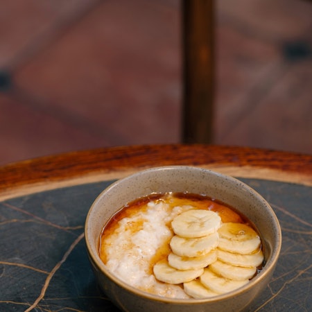 Organic jumbo oat porridge with banana and agave at Rondo. Rebecca Hope