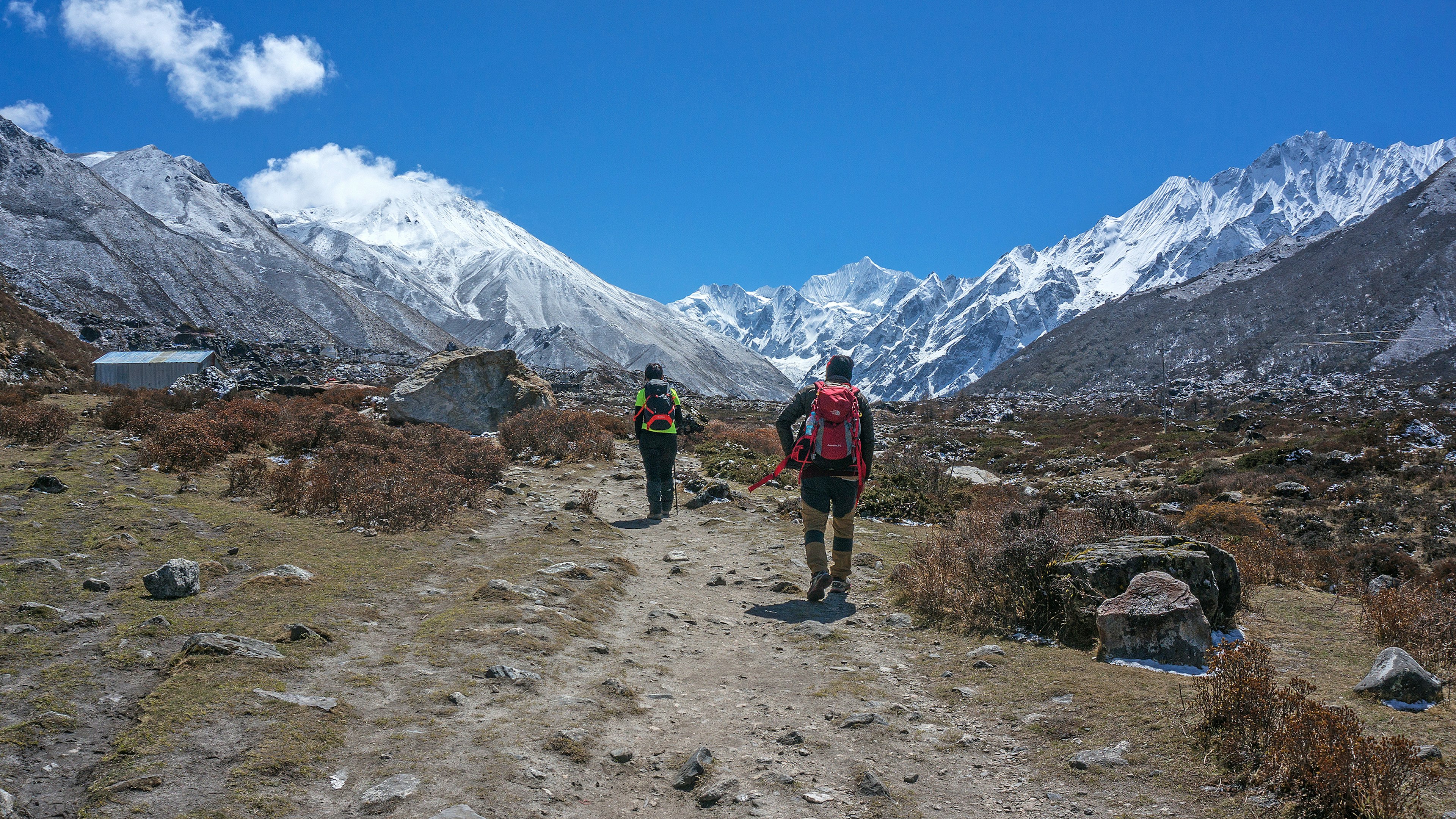 KYANJIN GOMPA, NEPAL - APRIL 13, 2018: Unidentified hikers are seen hiking from Langtang Valley to Kyanjin Gompa Village.  License Type: media  Download Time: 2023-03-22T04:08:26.000Z  User: aomi.ito_lonelyplanet  Is Editorial: Yes  purchase_order: