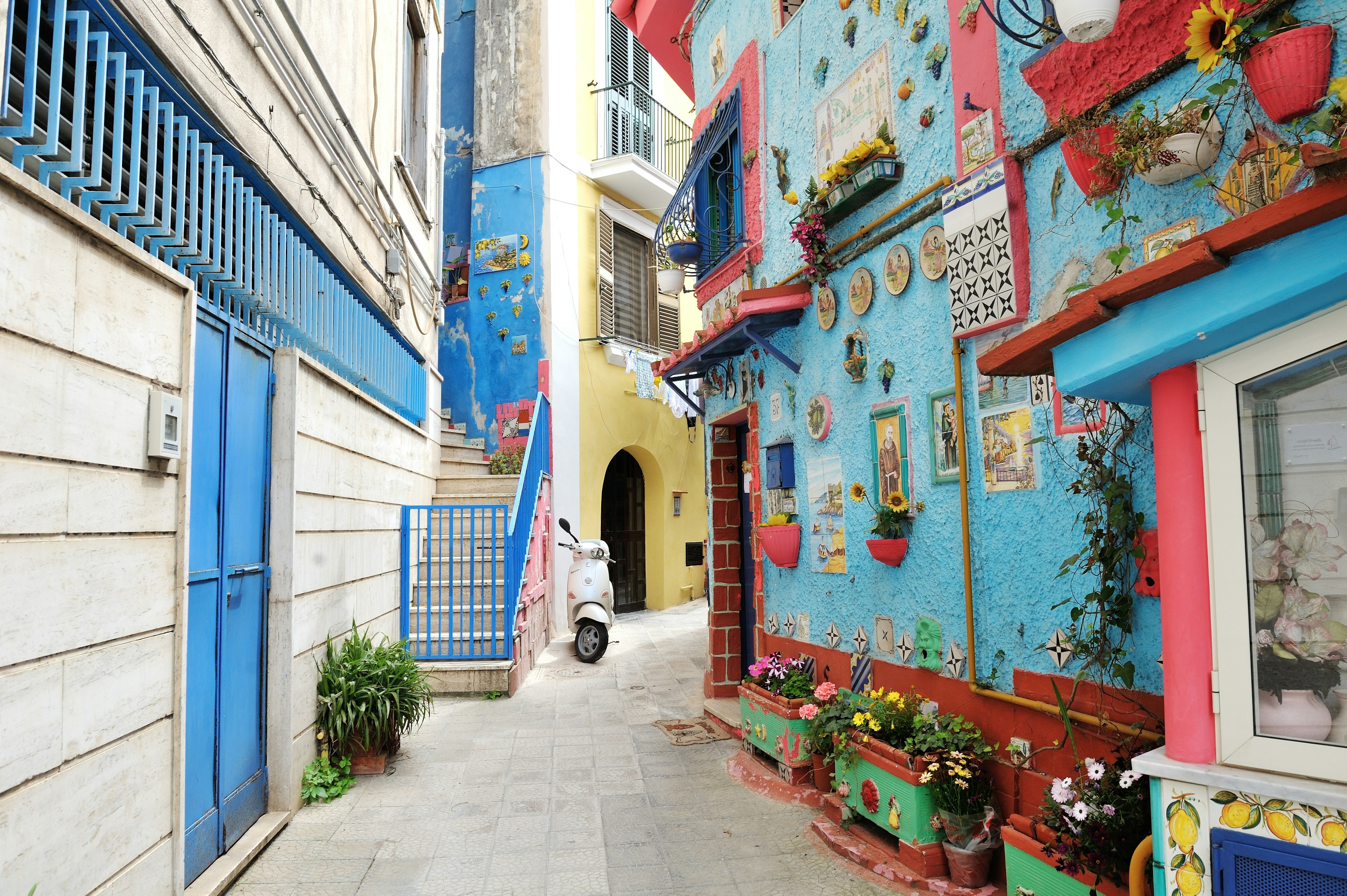 View on the narrow street of colored house, with traditional ceramics decoration of the city Vietri sul Mare.