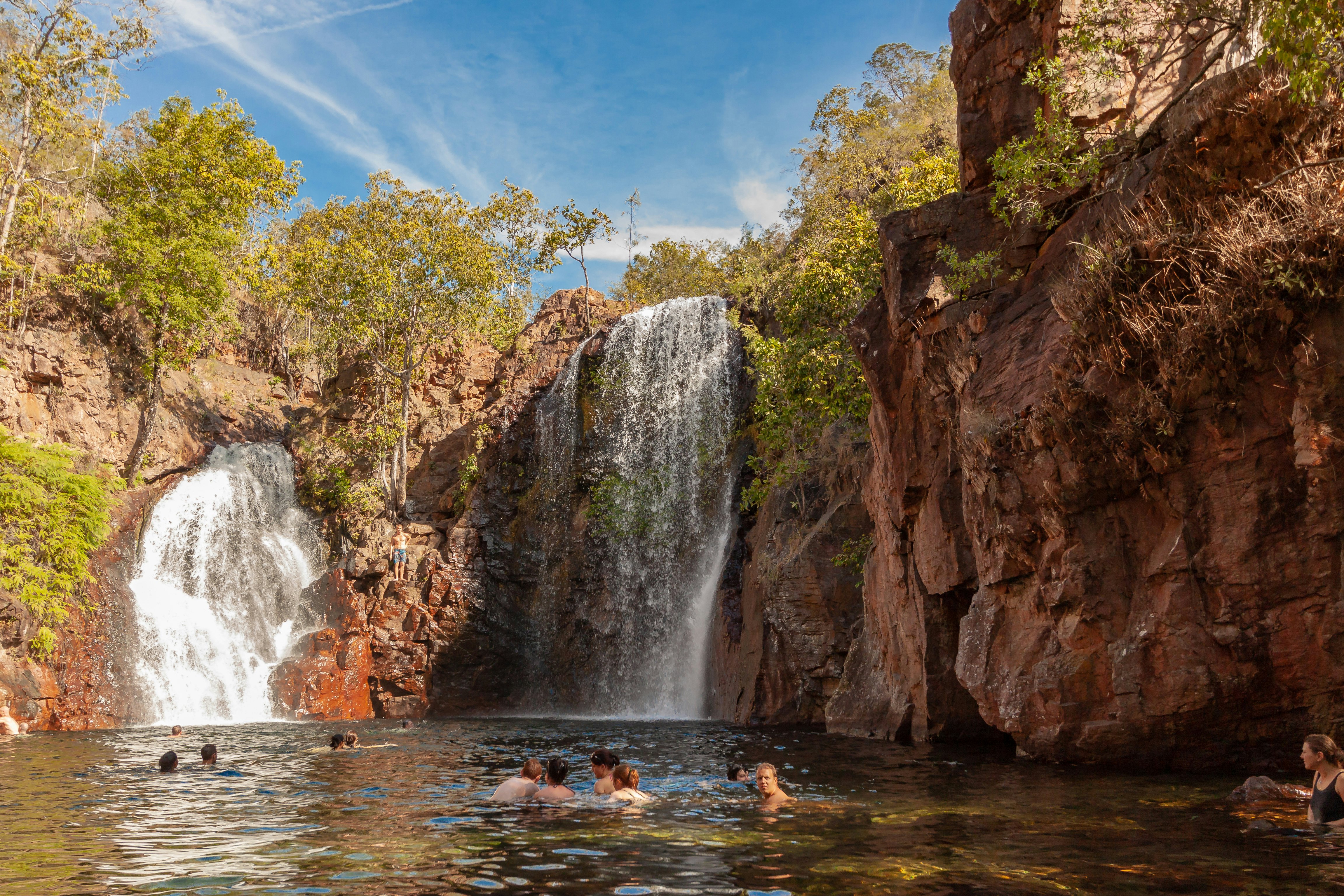 Tourists and residents of Darwin enjoy refreshing swim at Florence Falls, very popular destination for tourists and locals alike