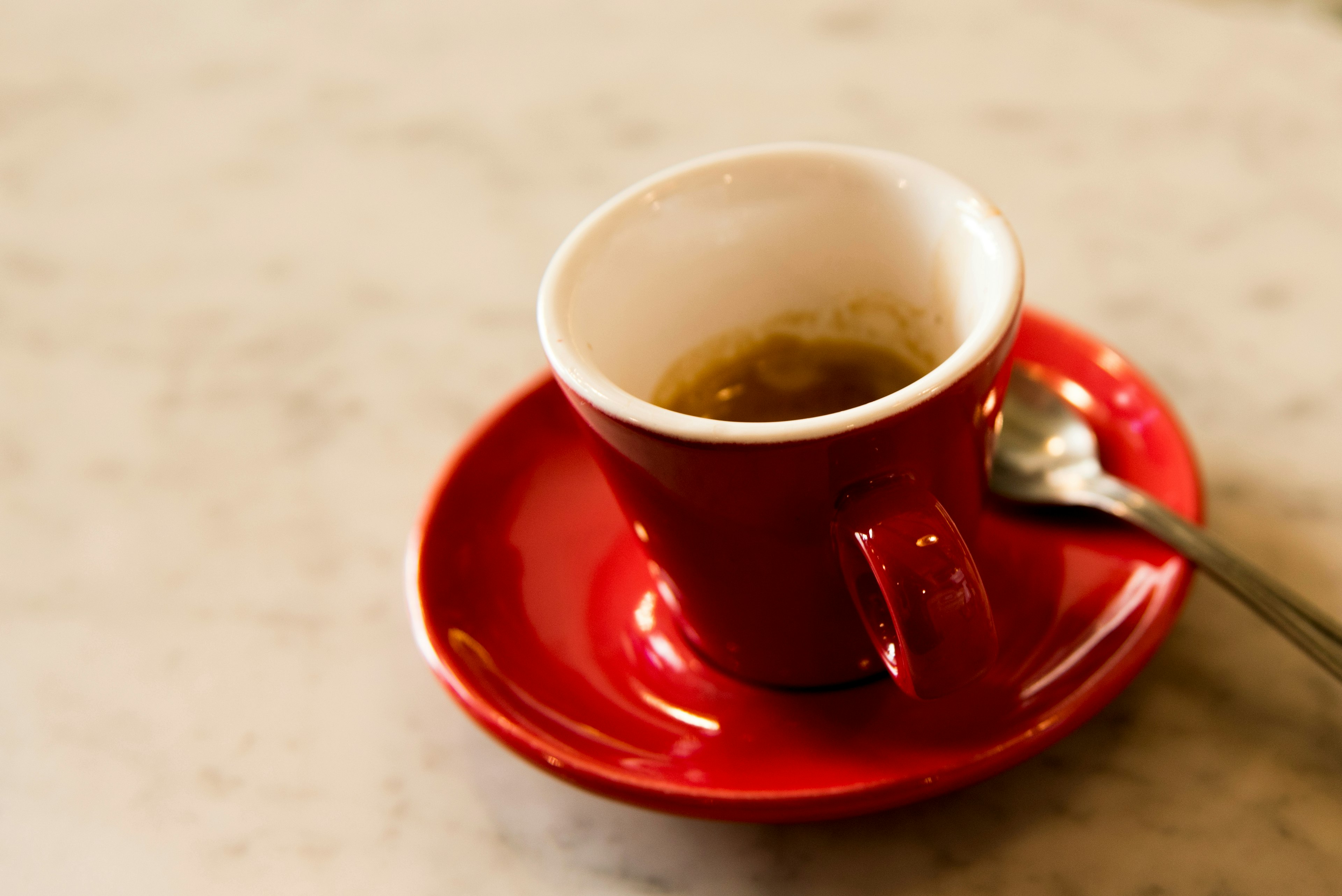 Hastily emptied cup of espresso on a counter in an espresso bar in Florence, Italy  License Type: media  Download Time: 2023-02-21T05:55:42.000Z  User: claramonitto  Is Editorial: No  purchase_order: