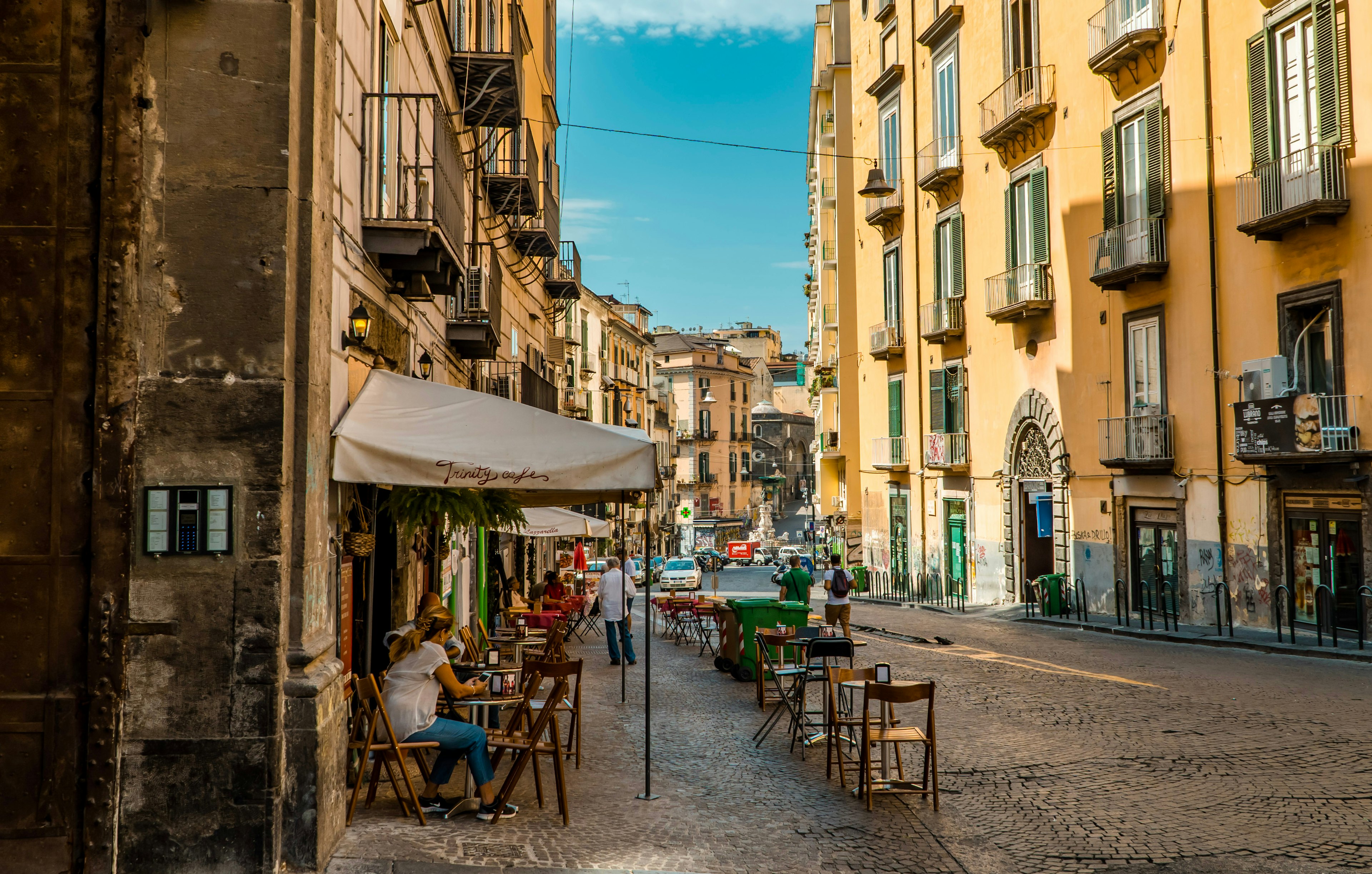 Street side cafe with traditional architecture in the historic center of Naples, Italy.