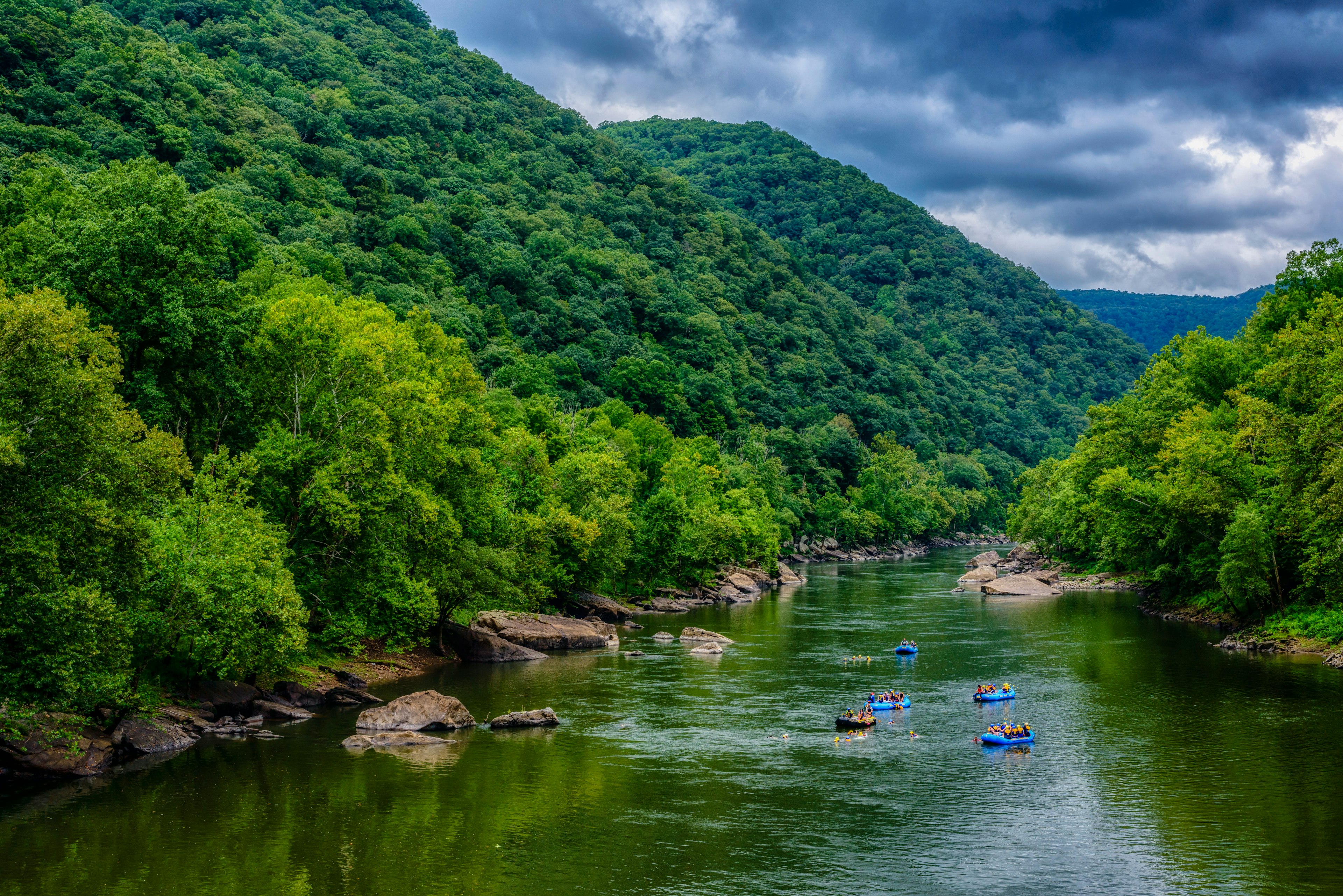 Whitewater rafts float down the river,  New River Gorge National Park and Preserve, Fayette County, West Virginia, USA