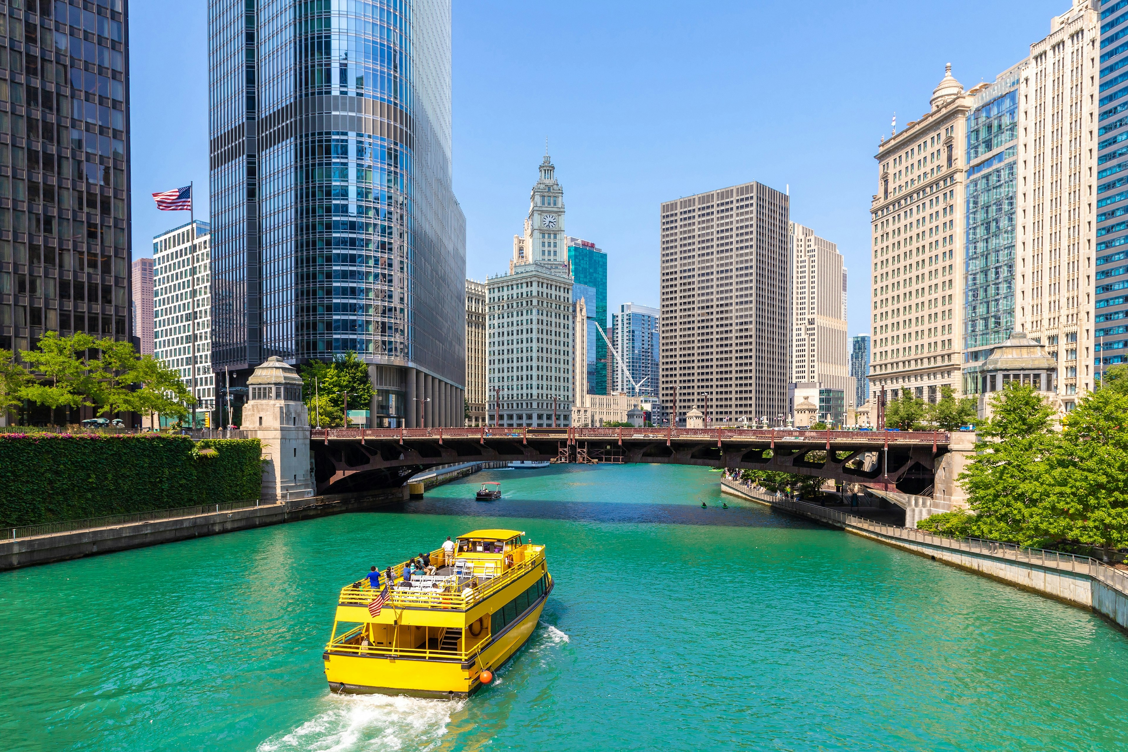 A yellow tour boat on the Chicago River in Chicago, Illinois, USA.