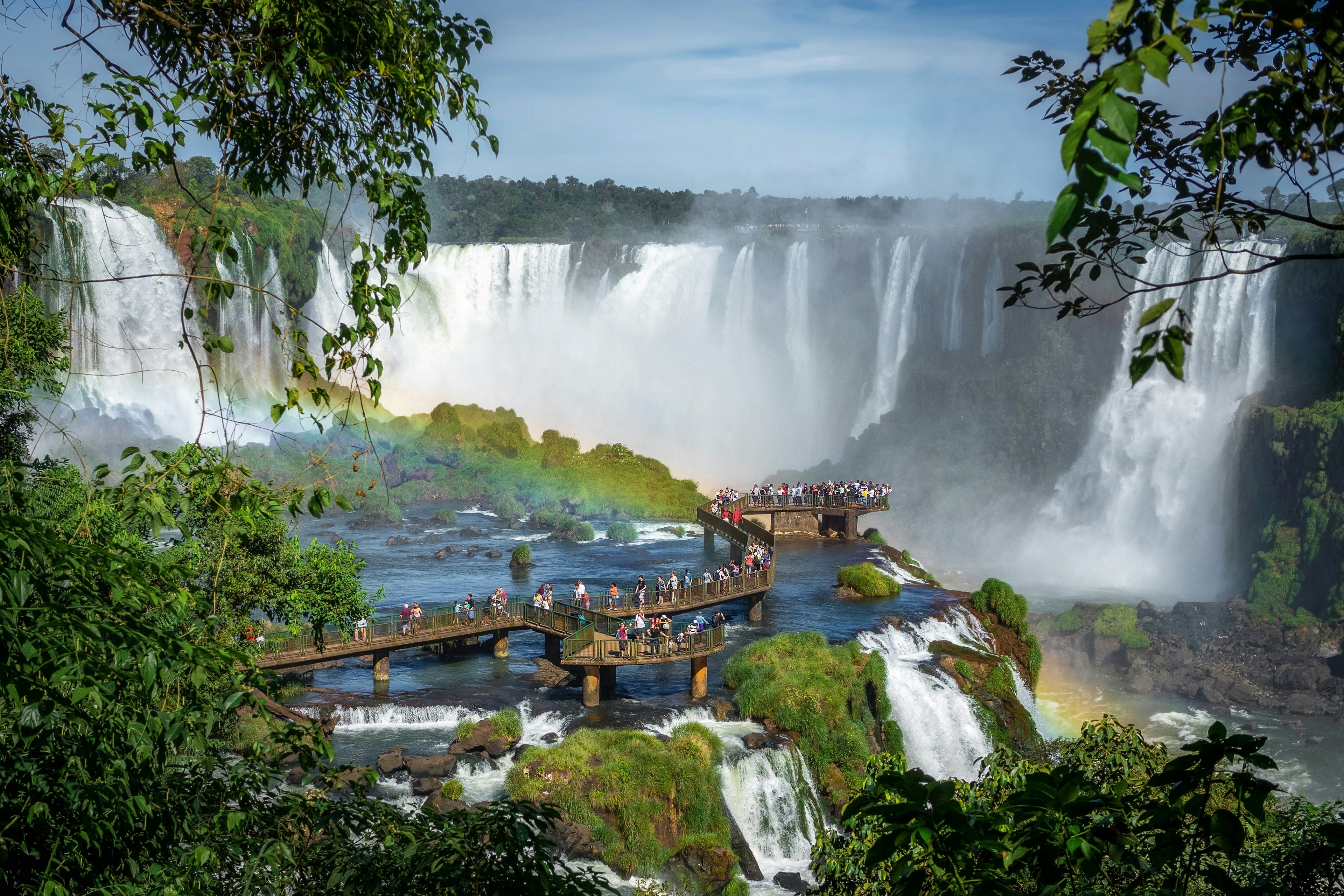 Tourists exploring Iguazu Falls on the border of Brazil and Argentina.