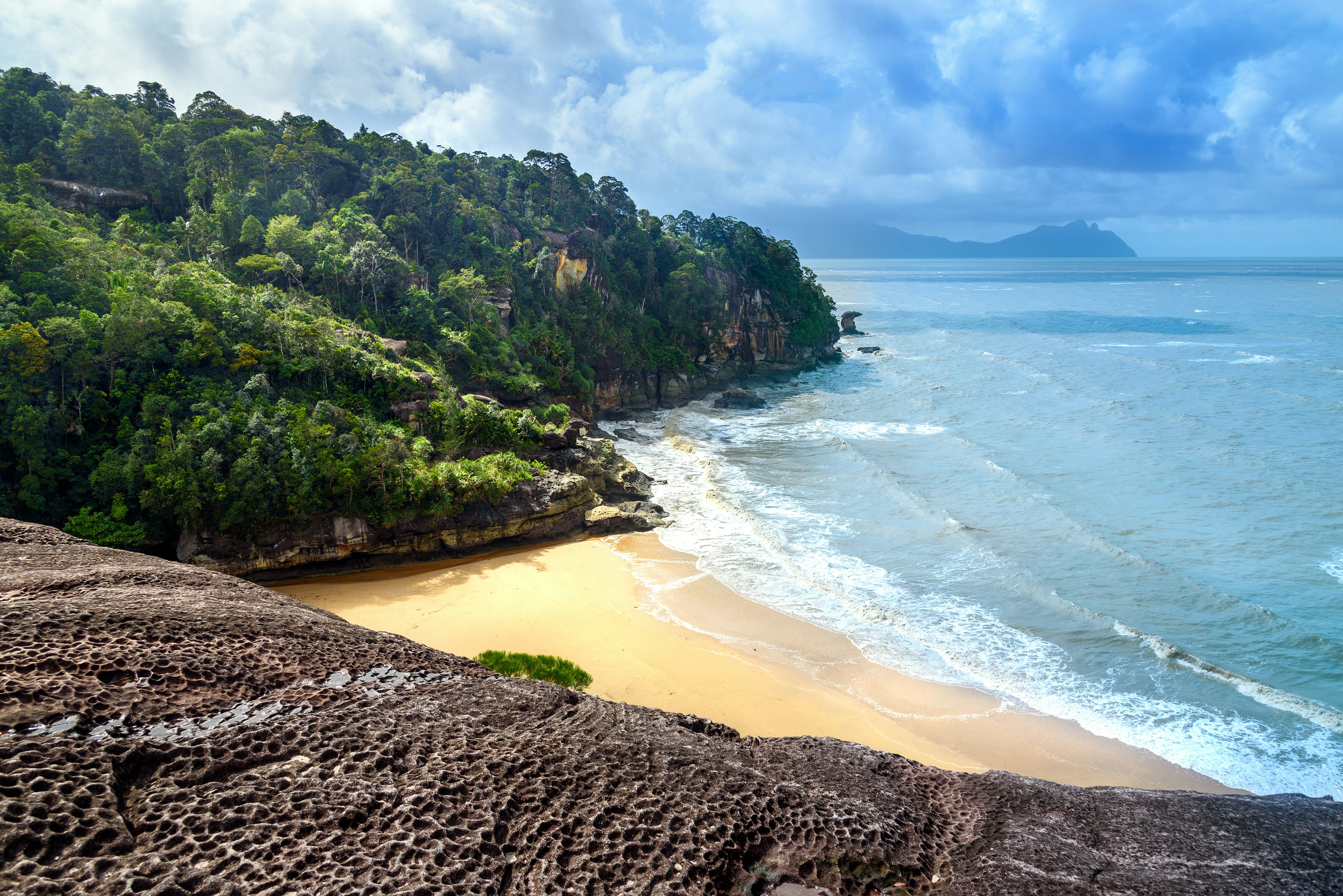 View on the beach from cliff. Telok padan kecil in Bako National Park. Sarawak. Borneo. Malaysia  License Type: media  Download Time: 2023-05-01T16:54:03.000Z  User: Norma.PrauseBrewer_LonelyPlanet  Is Editorial: No  purchase_order: