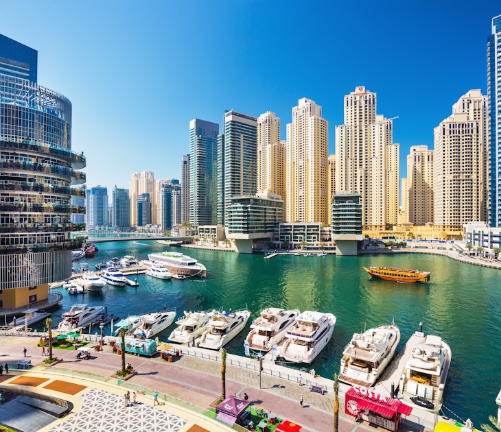 DUBAI MARINA ,UNITED ARAB EMIRATES-FEBRUARY 28, 2017: Promenade and canal in Dubai Marina with luxury skyscrapers around,United Arab Emirates License Type: media Download Time: 2023-11-20T02:03:53.000Z User: mvm_lonelyplanet Is Editorial: Yes purchase_order: