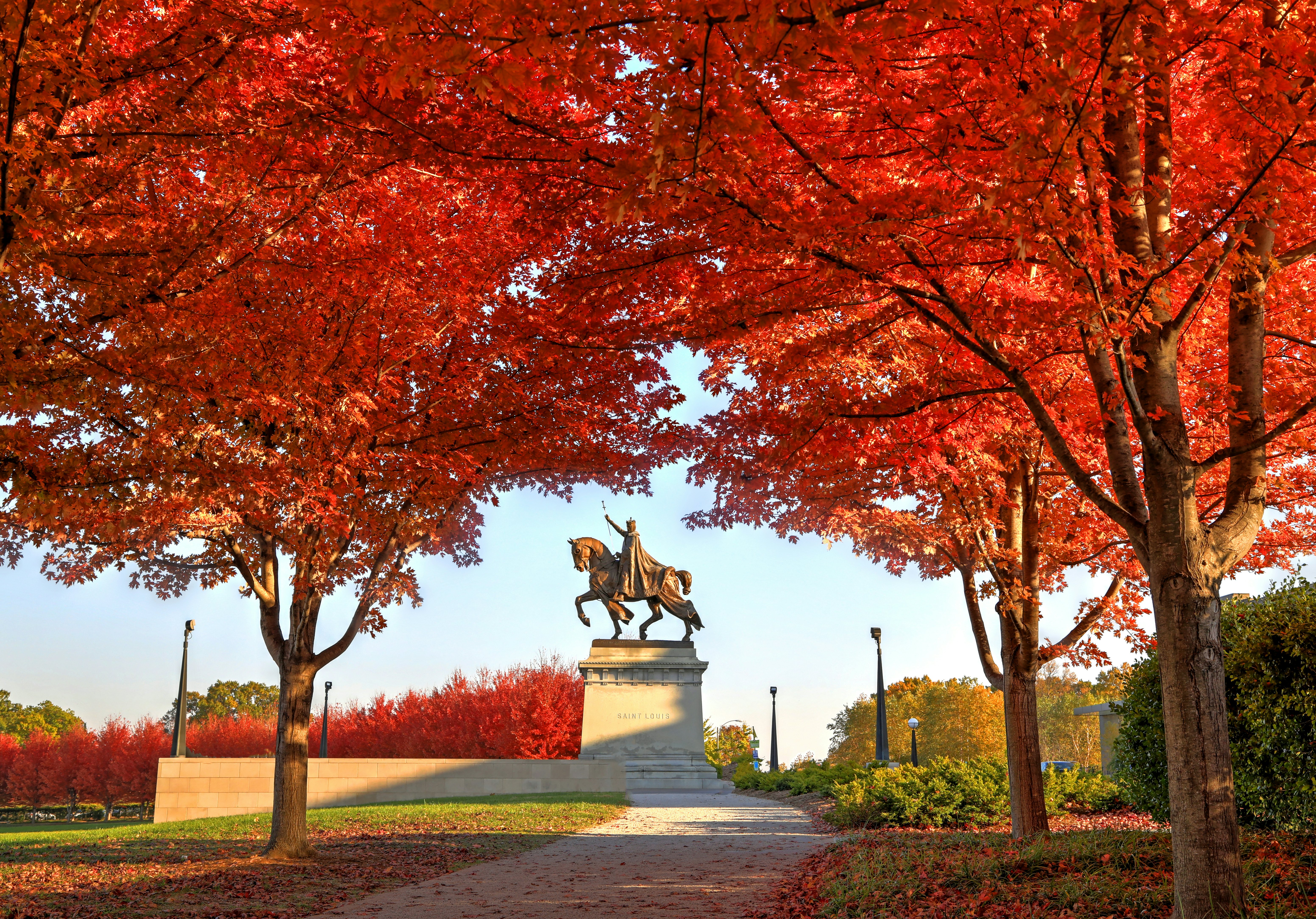 Fall foliage around the Apotheosis of St. Louis statue of King Louis IX of France in Forest Park, St. Louis, Missouri. Shutterstock