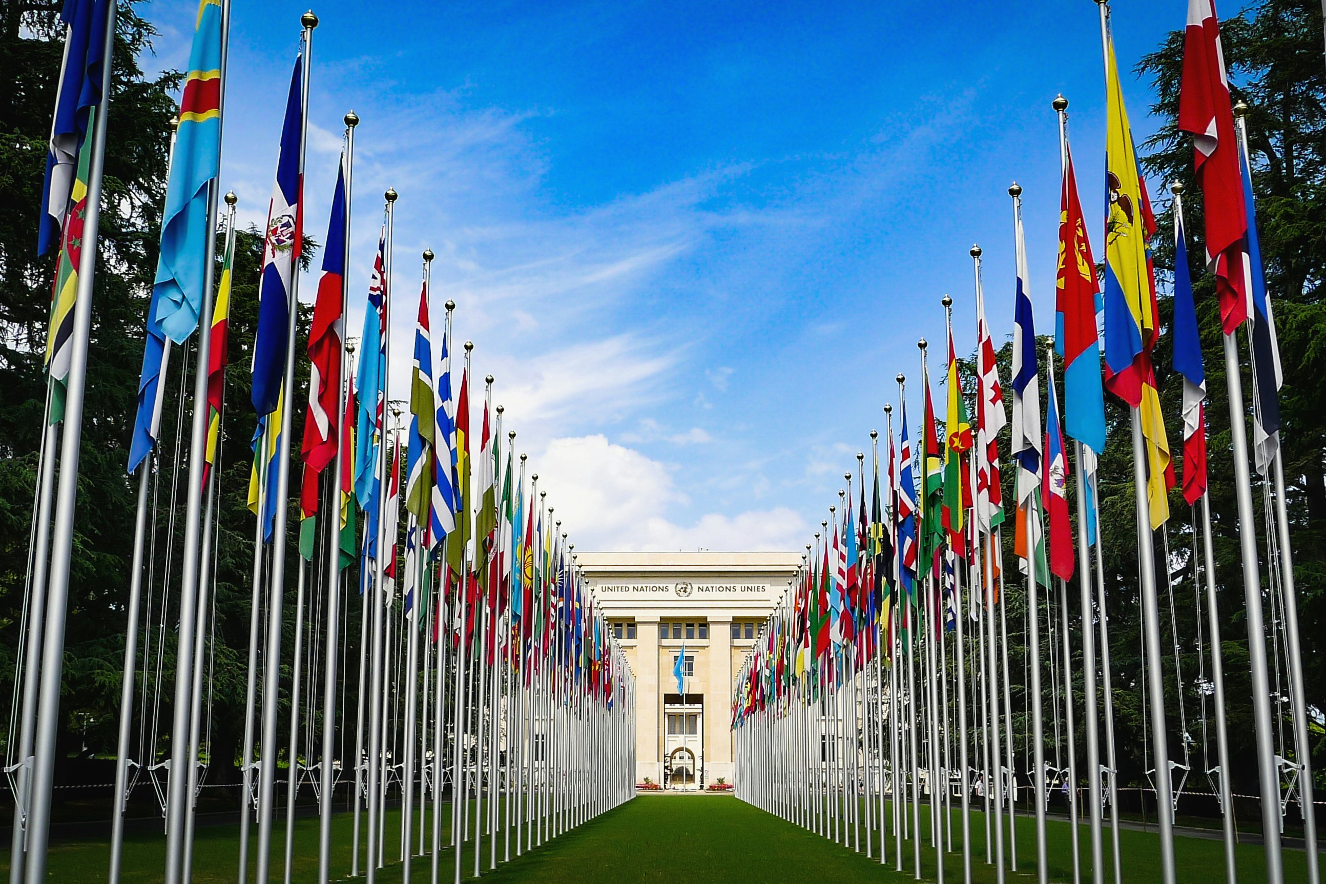 A view of flags in front of the United Nations building in Geneva, Switzerland.