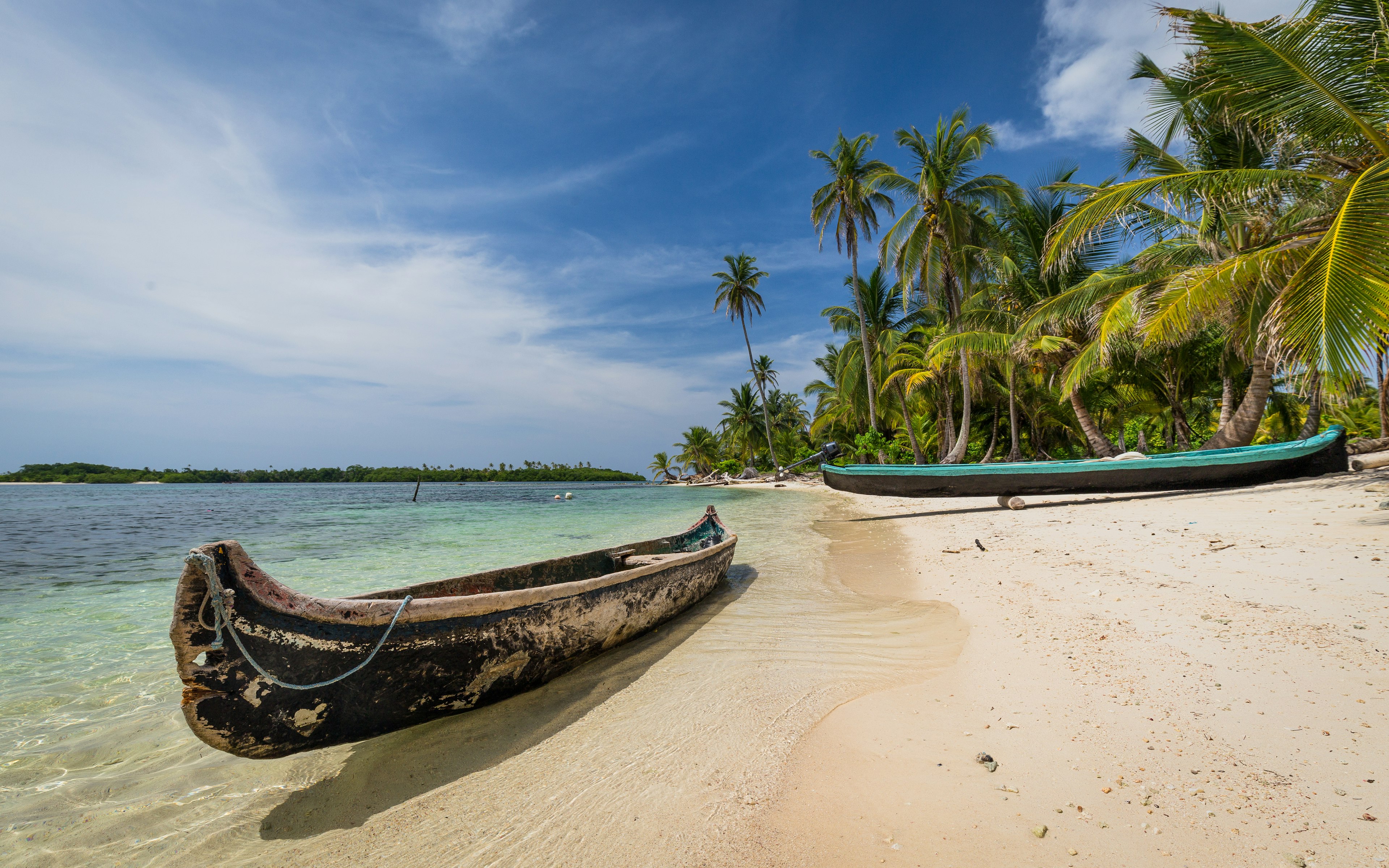 Indigenous canoes on a remote beach in the San Blas Islands, Panama.