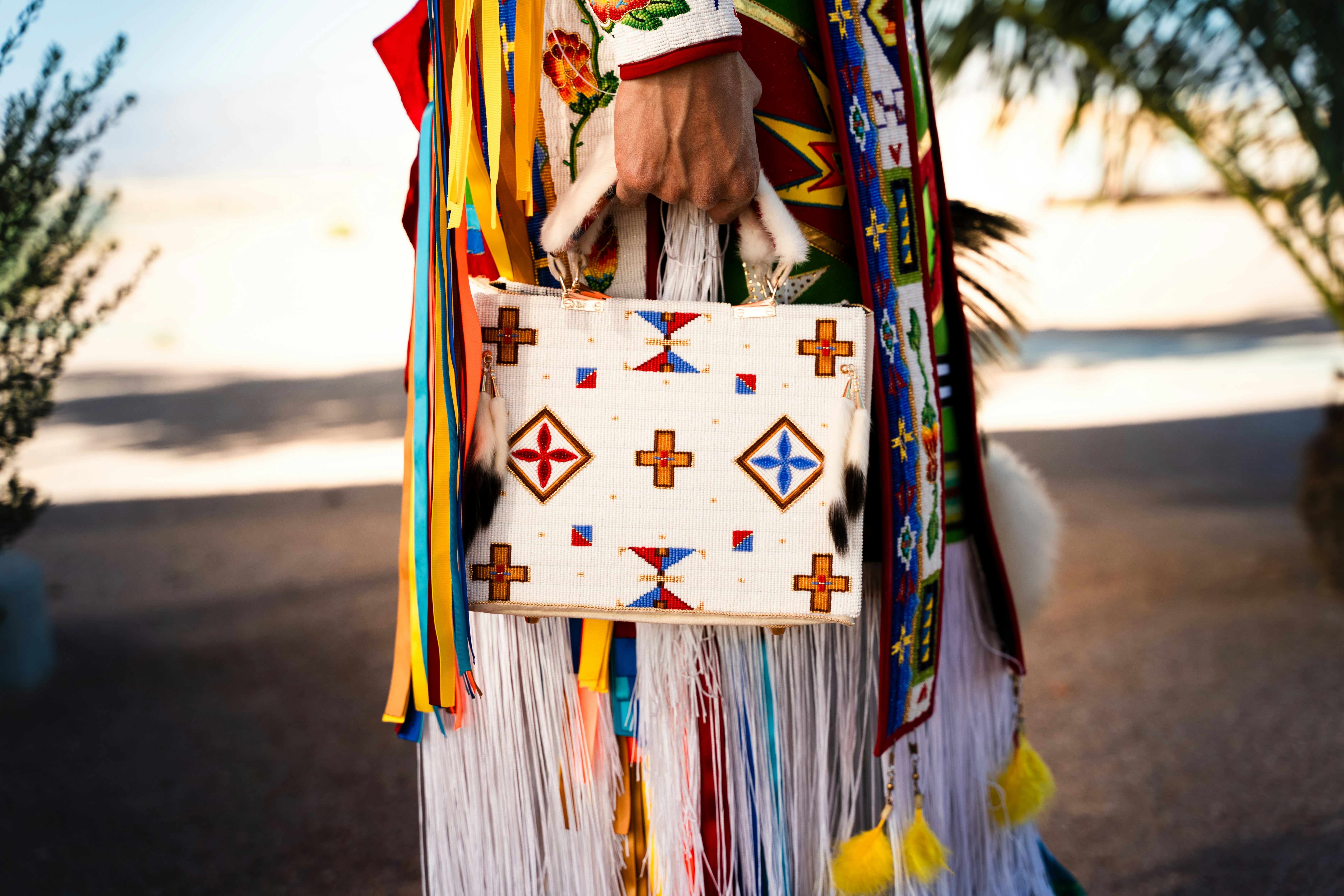 Custom beadwork by Adrian Stevens and Sean Snyder, two Native American artists and dancers from Nevada. MP has more info on the bag and its significance.