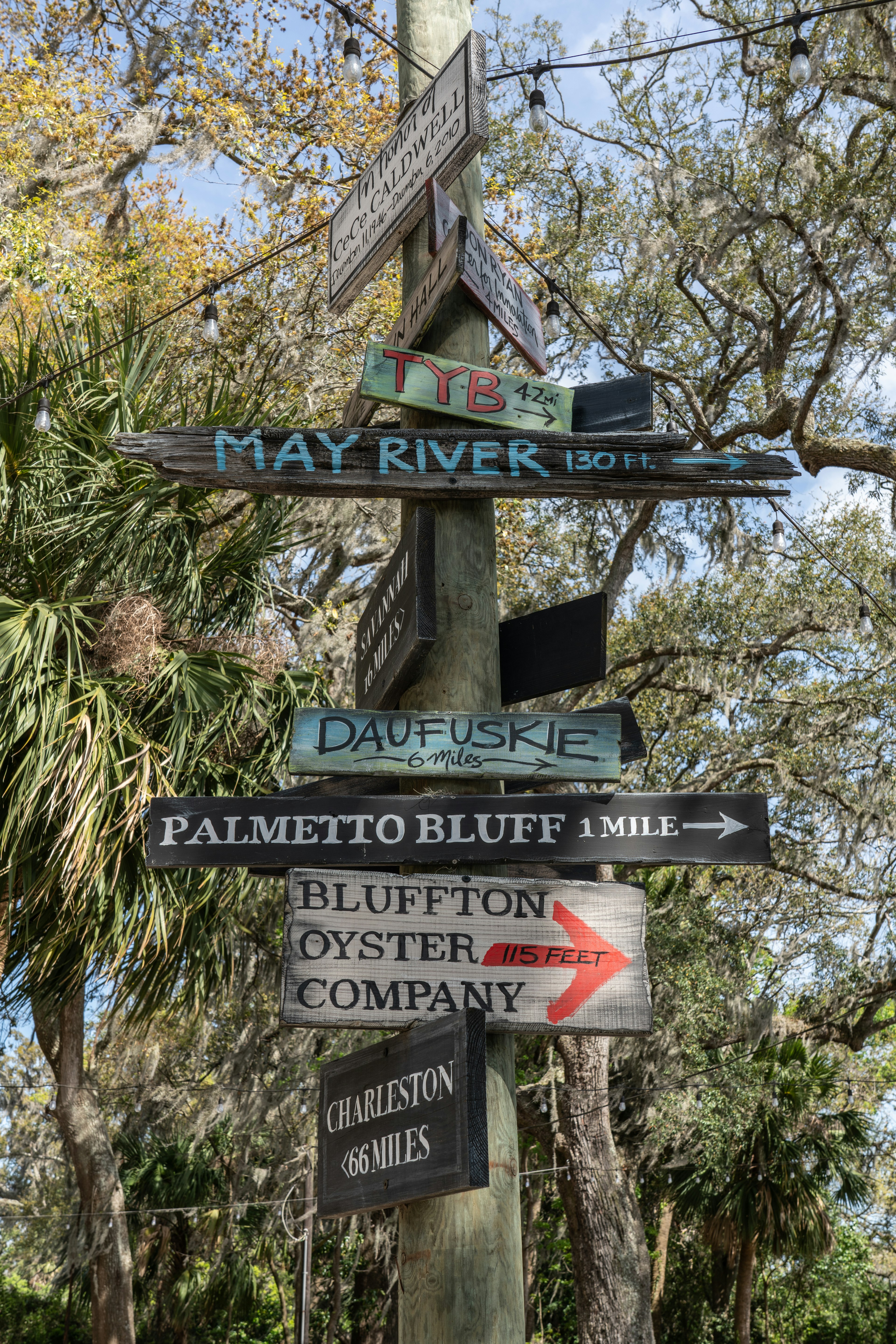 Directional sign in Bluffton, SC, with arrows for Daufuskie, Palmetto Bluff, Bluffton Oyster Company and Charleston