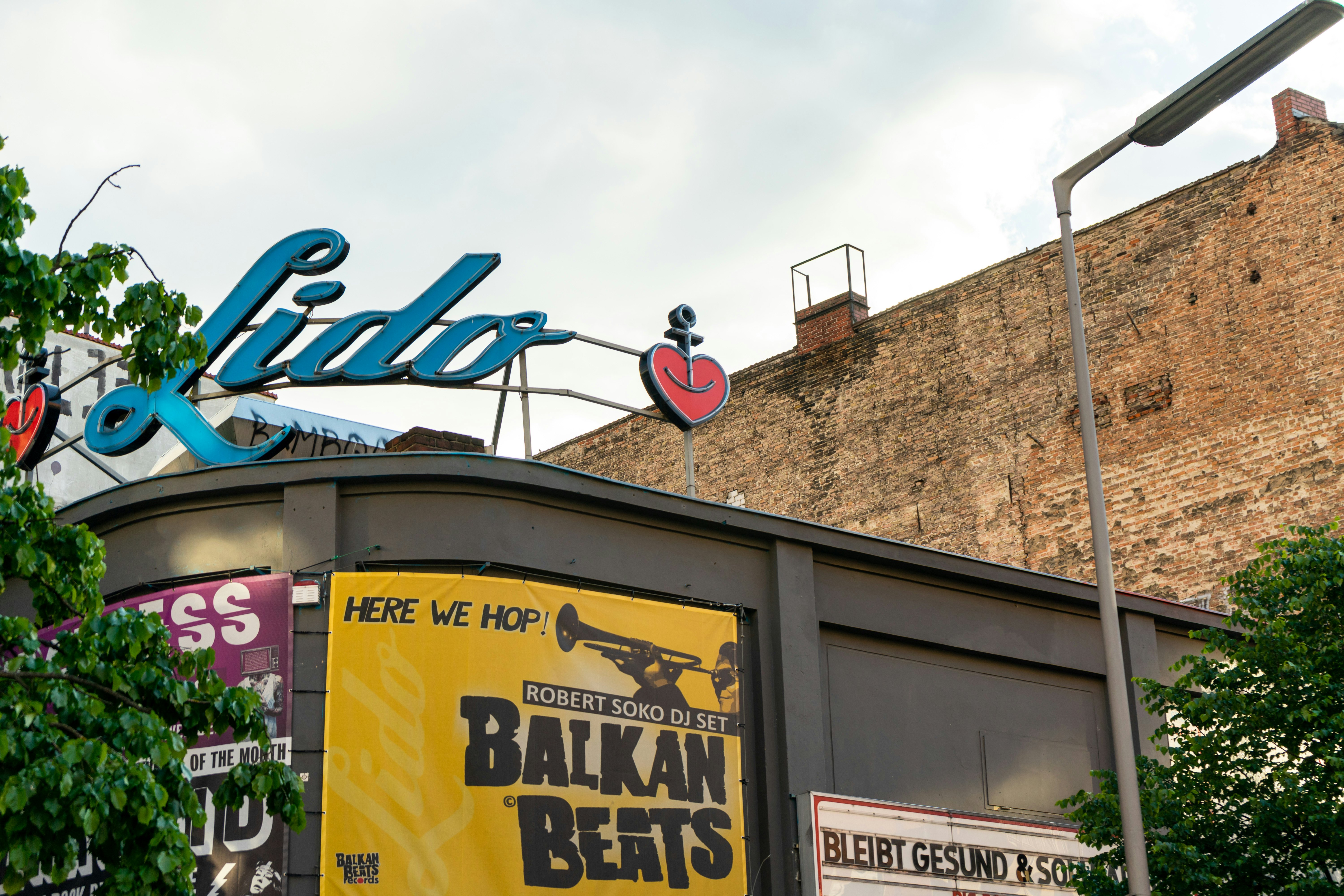 The exterior of a nightclub with a large sign above it that reads "Lido"