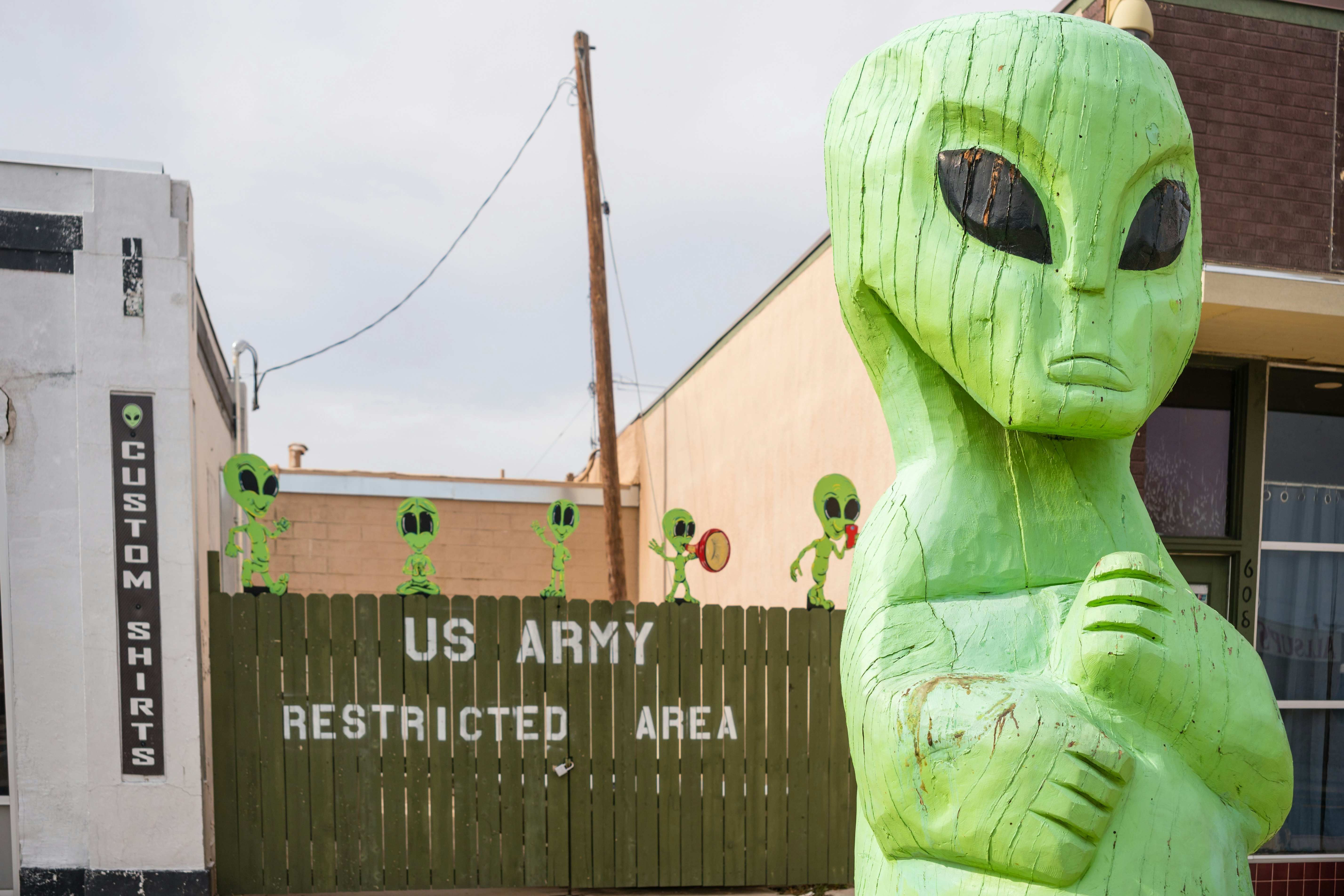 A sculpture of a green extraterrestrial on a street in Roswell, New Mexico, USA