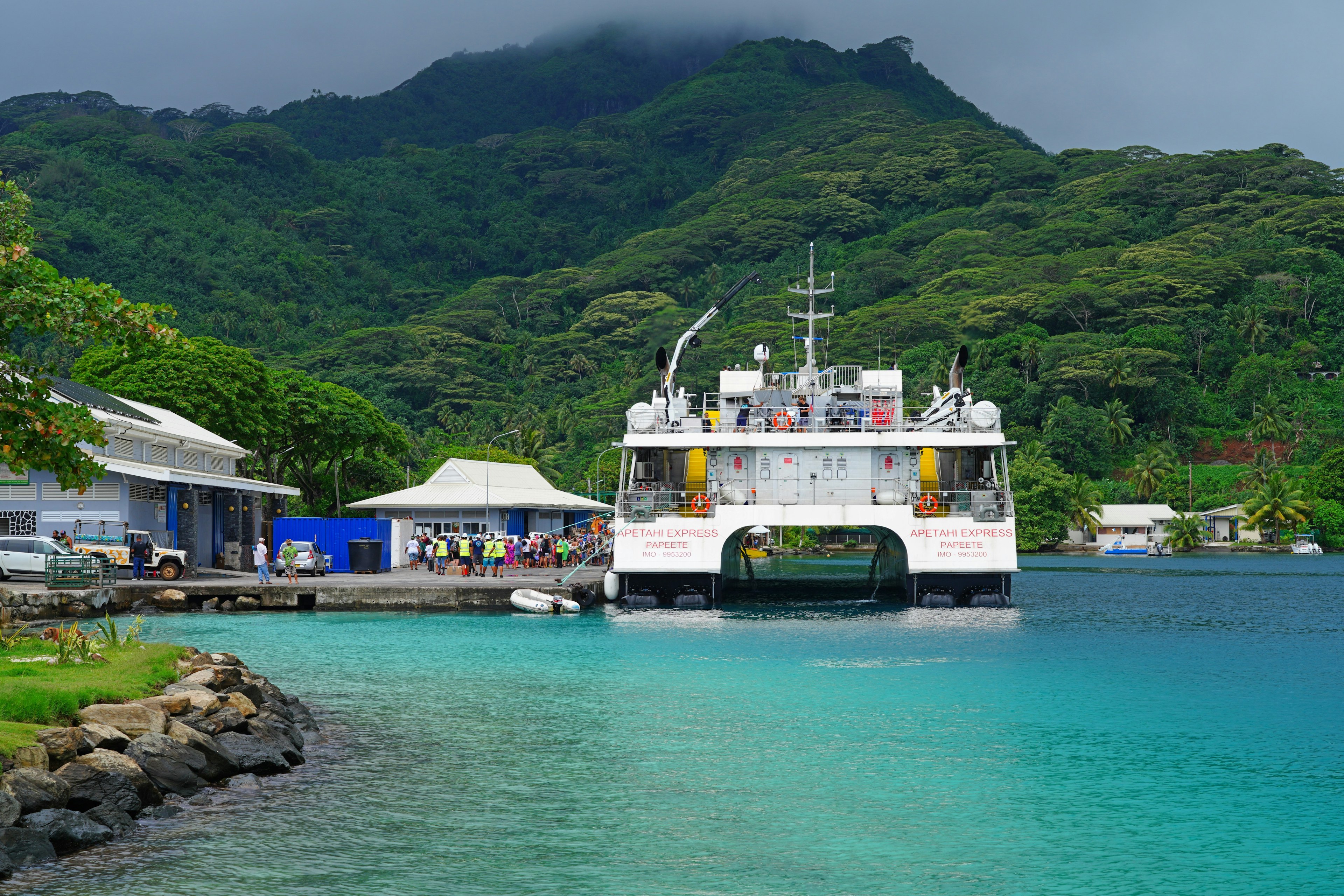 HUAHINE, FRENCH POLYNESIA – 5 DEC 2023 – View of the Apetahi Express, a ferry connecting islands in French Polynesia, in the Fare harbor, Huahine, Society Islands.