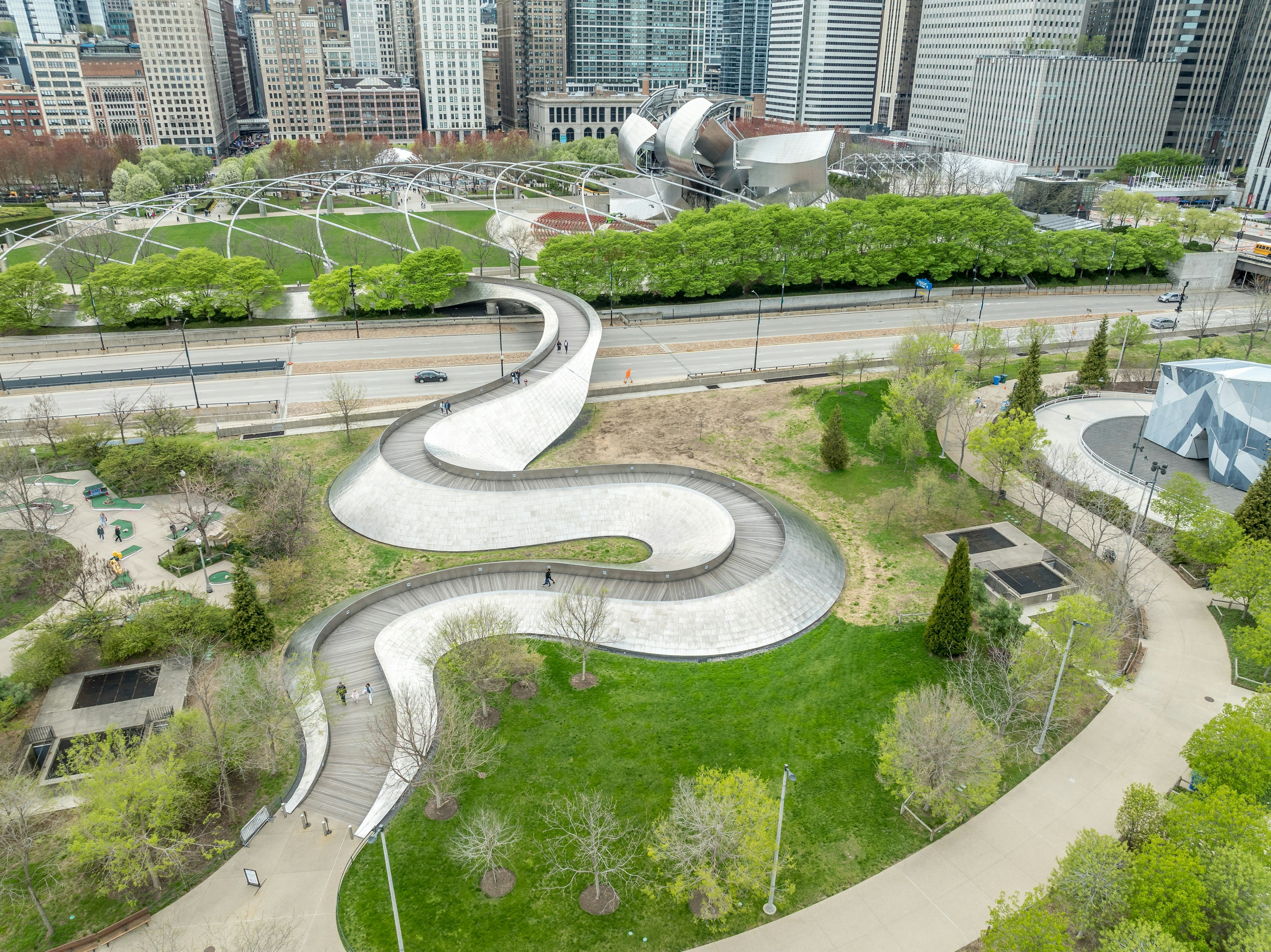 Winding pedestrian bridge with stainless steel panels in Chicago