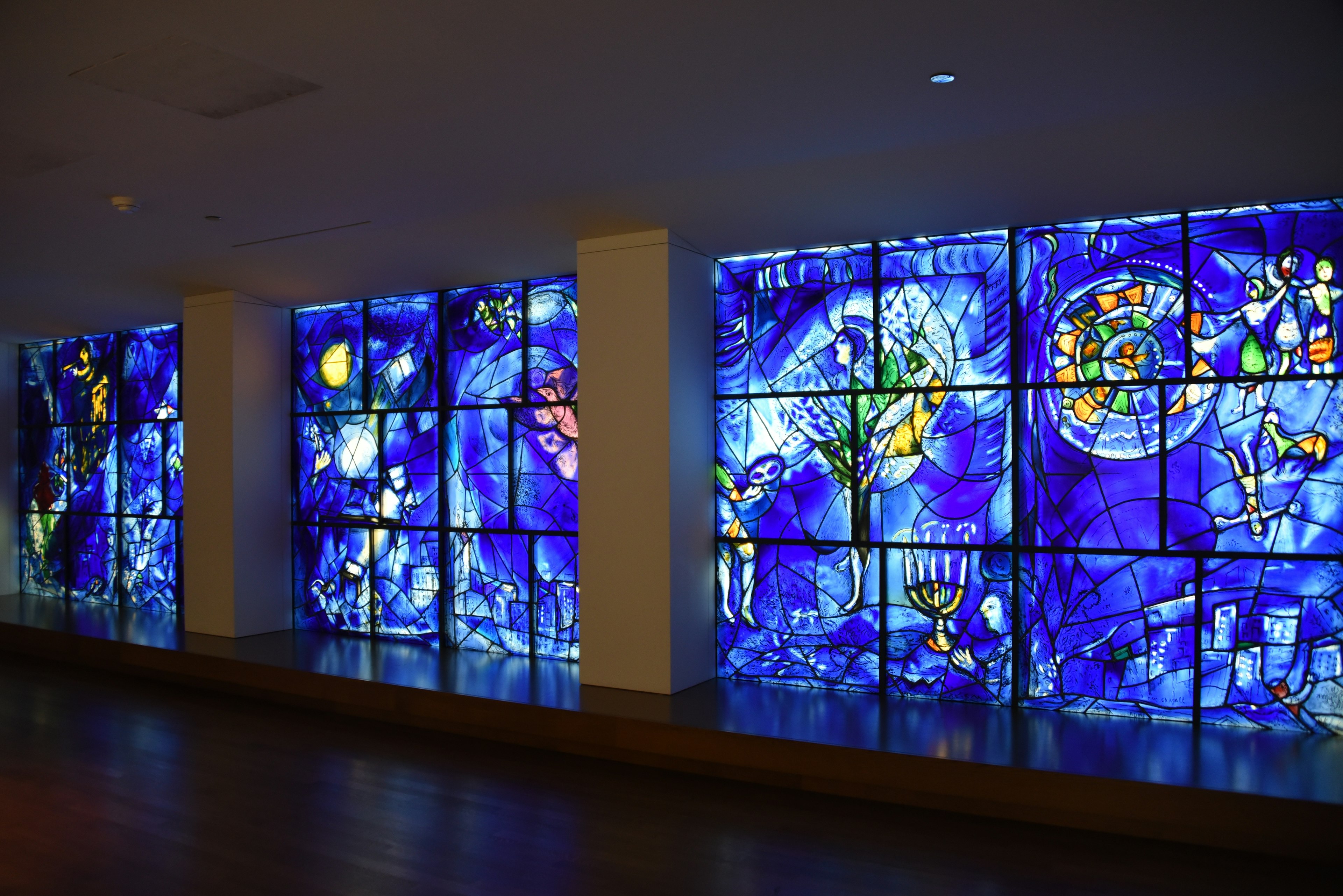 Marc Chagall's "America Windows" are blue stained glass windows on display at the Art Institute of Chicago.