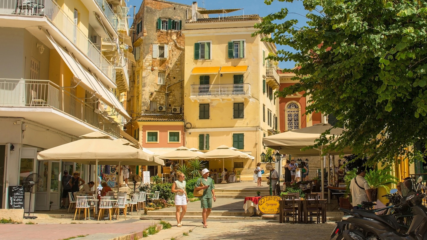 Corfu, Greece - June 6 2024. Bars and restaurants in Mitropolis Square in historic centre of Corfu Old Town, Greece. A UNESCO World Heritage Site, blend of Venetian, French and Bristish architecture, License Type: media, Download Time: 2025-01-23T08:33:36.000Z, User: sashabrady26, Editorial: true, purchase_order: 65050 - Digital Destinations and Articles, job: Lonely Planet, client: Photo haul, other: Sasha Brady