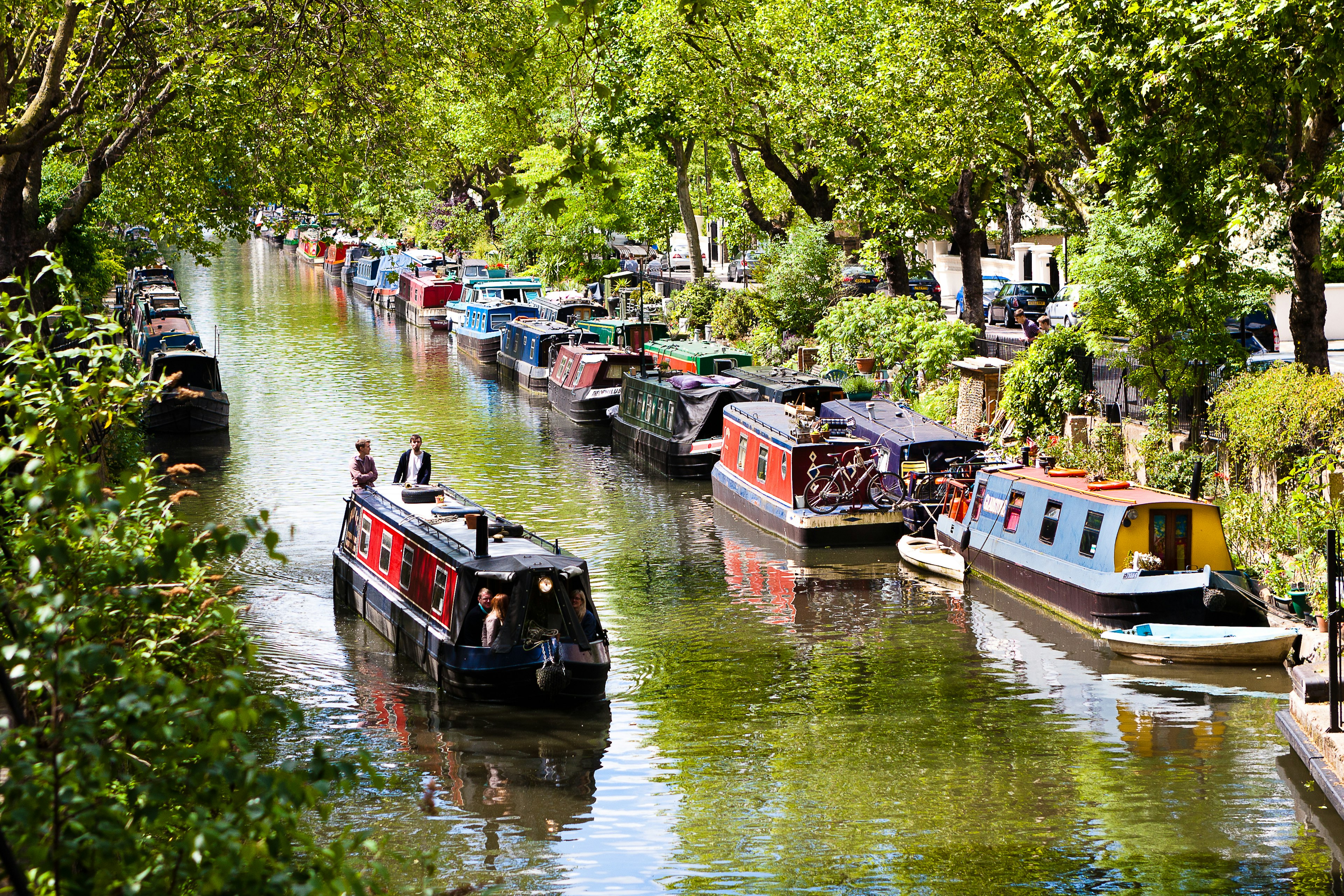 London, England. May 25, 2014. Tourists strolling by boat in Little Venice, Regent's Canal, London, England.