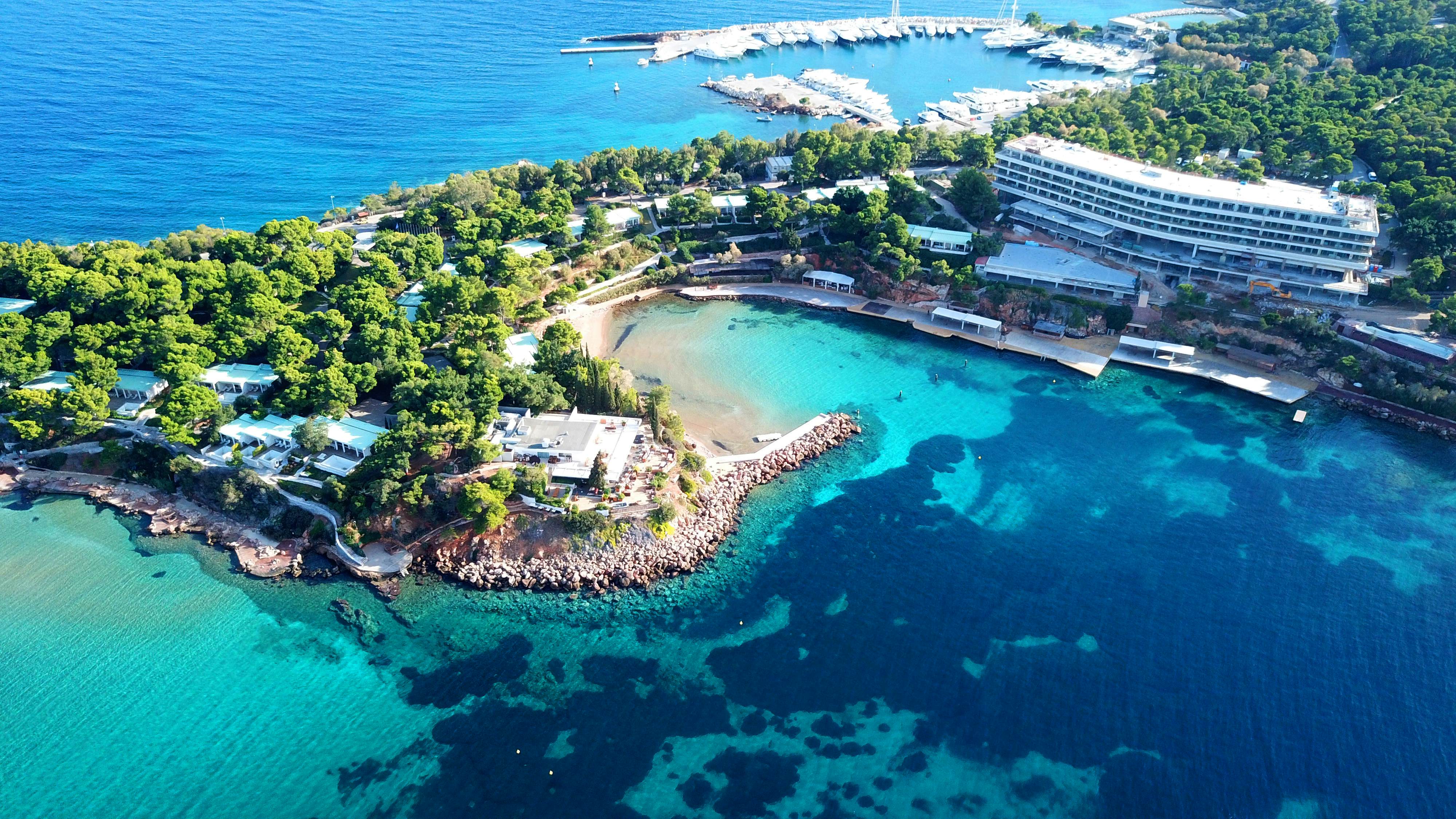 Aerial drone bird’s-eye photo of a spit with a sandy beach and turquoise clear waters