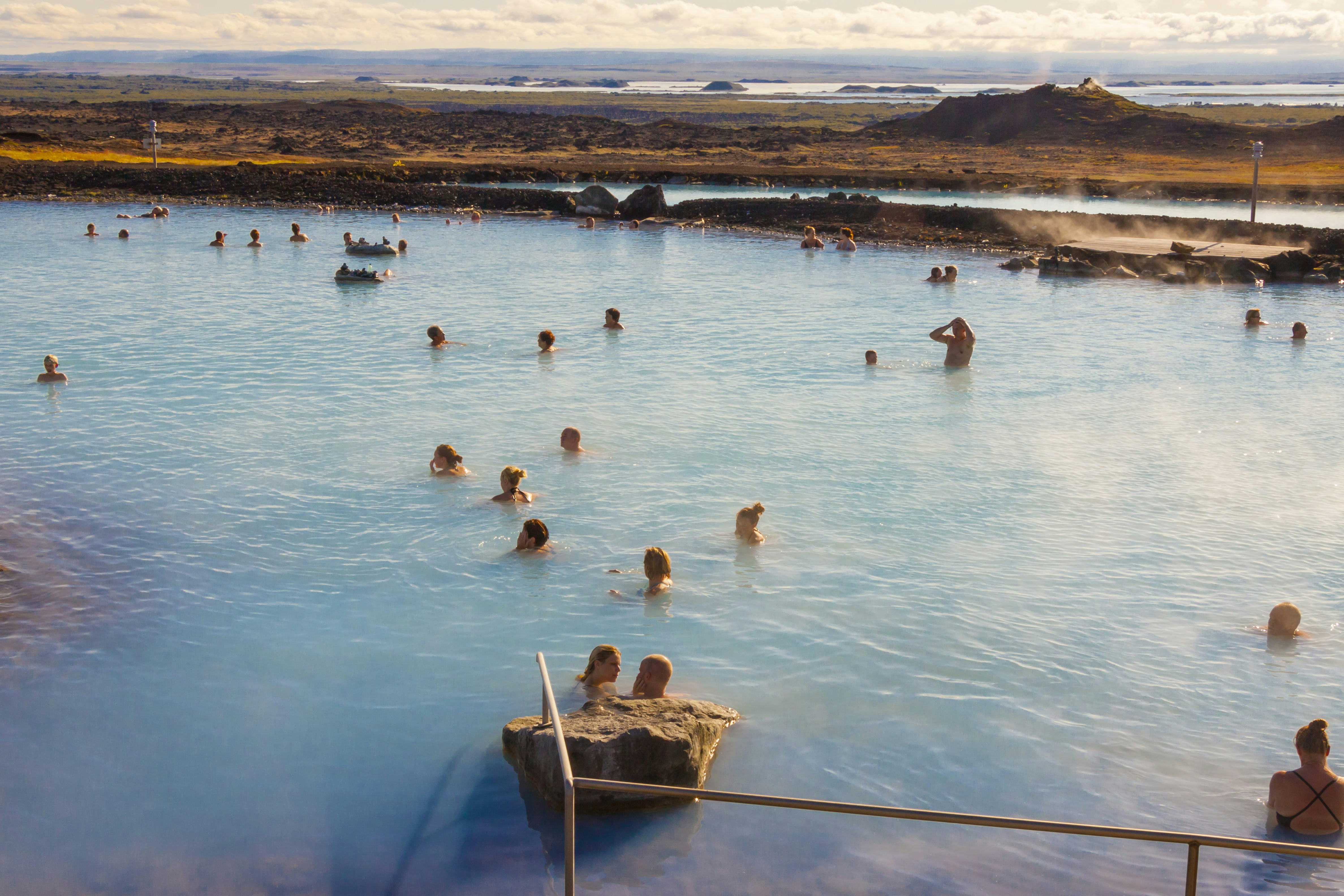 Visitors bathe in the Jardbodin Lagoon (Mývatn Nature Baths).