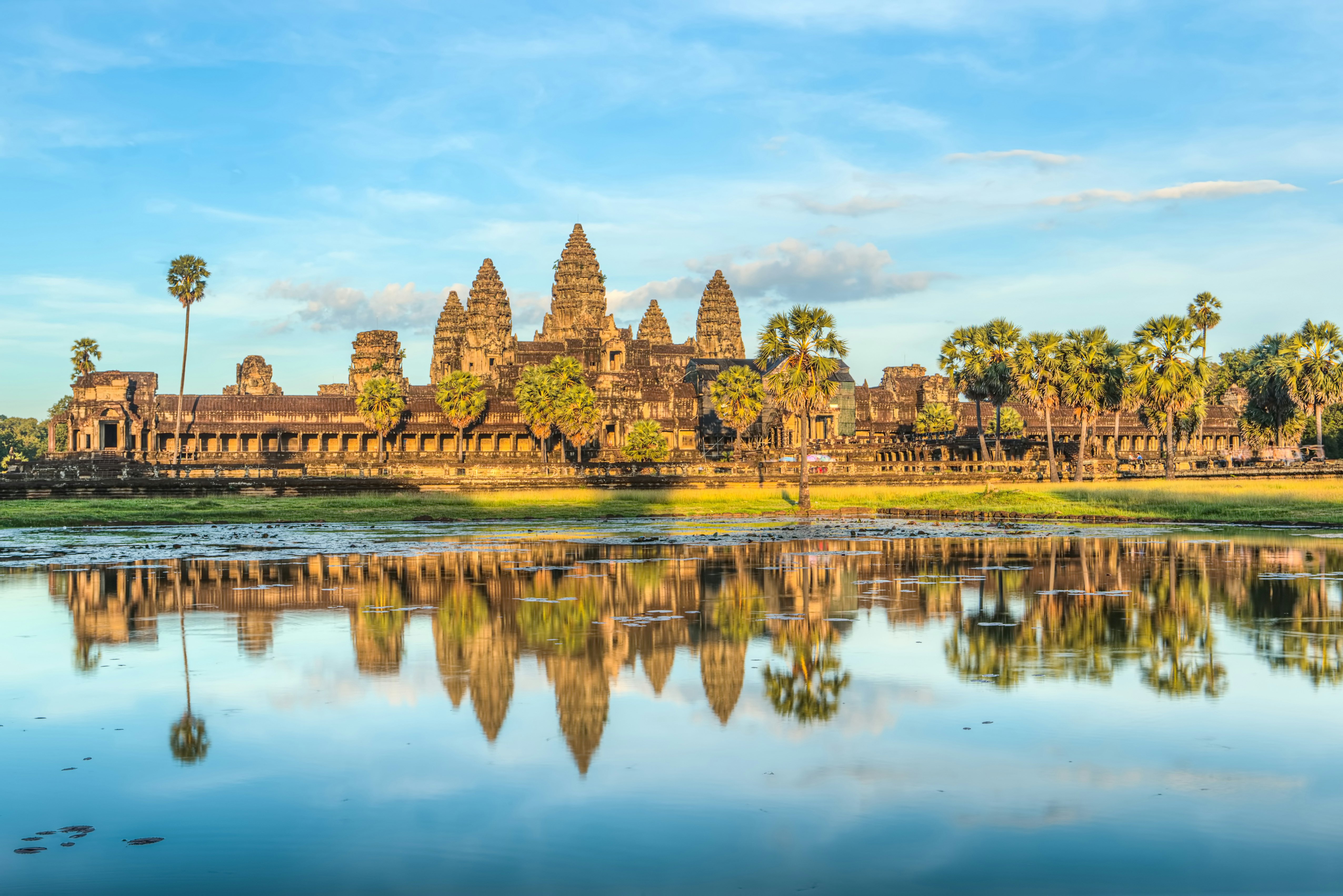 Angkor Wat reflected in the waters of its surrounding moat, Cambodia.