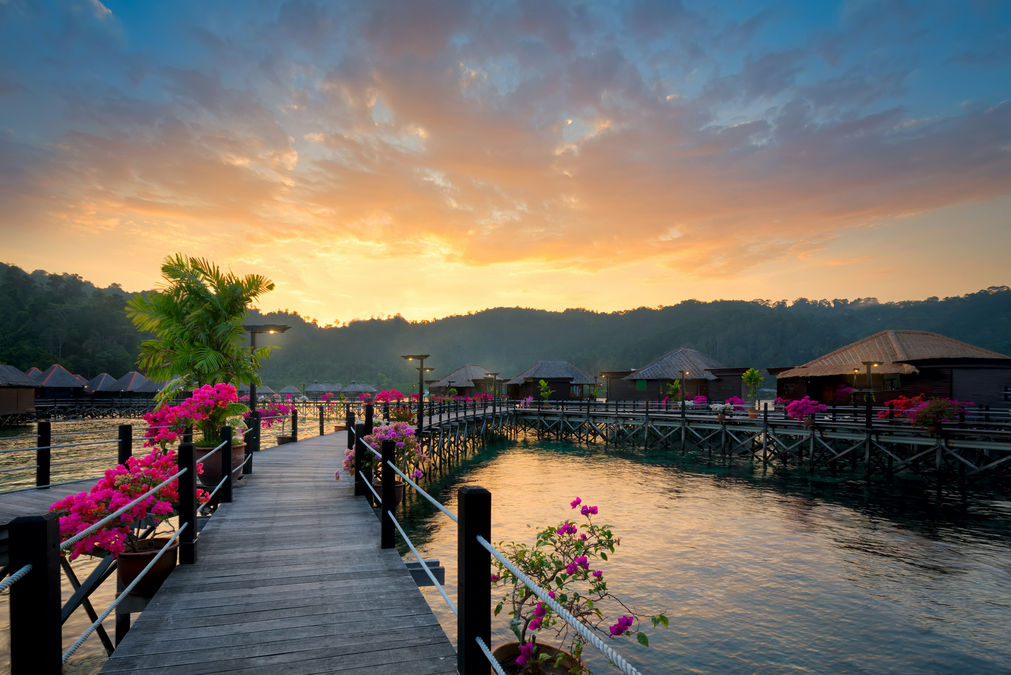 March 21, 2016: Bungalows at Gayana Eco Resort during sunset.